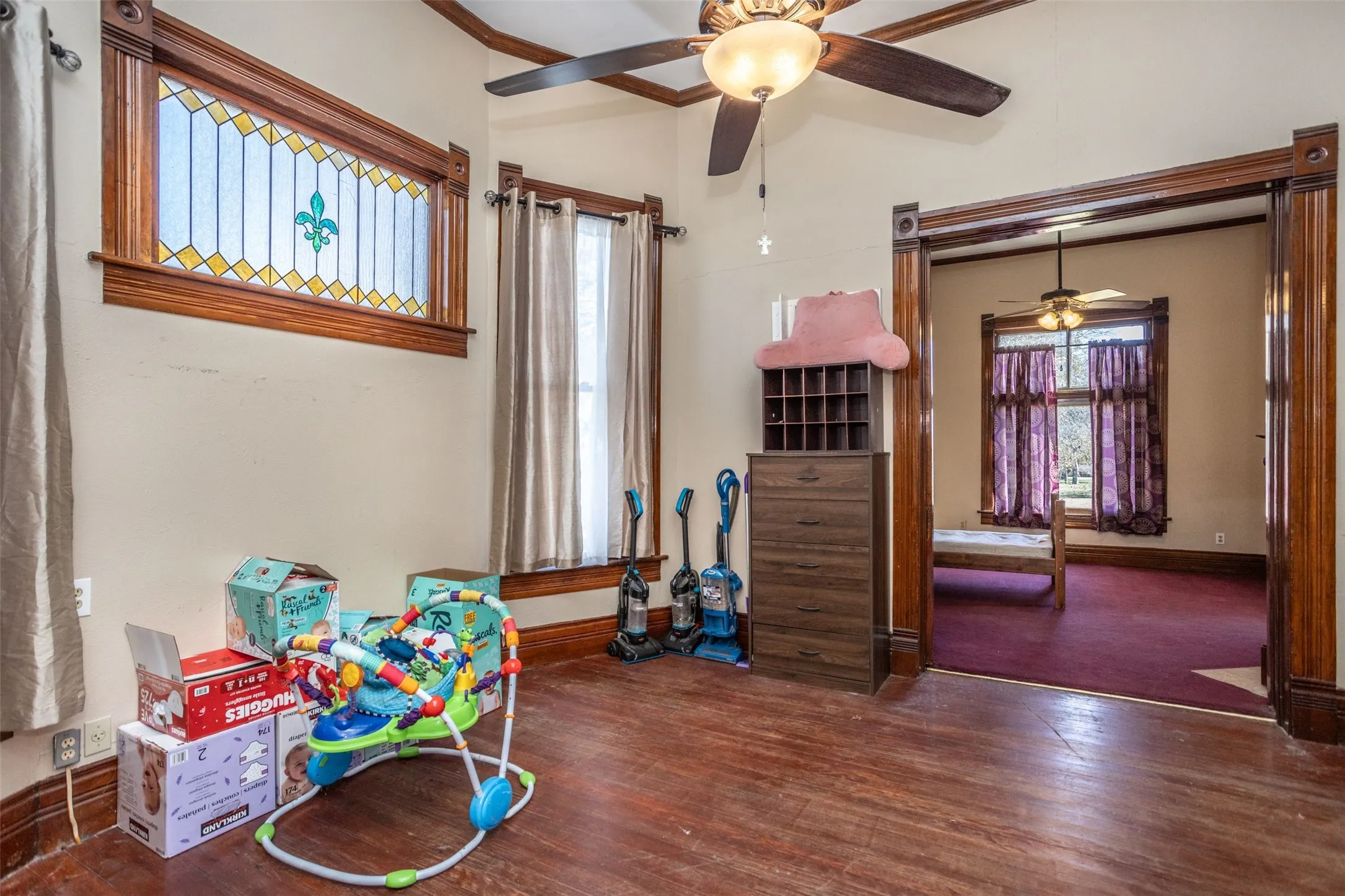 original moldin,g beautiful hardwood flooring, and original stained glass