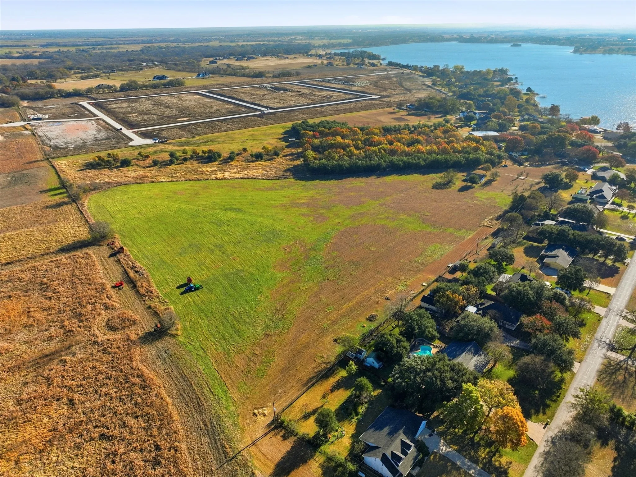 Aerial view of property's location featuring rural landscape and a large body of water