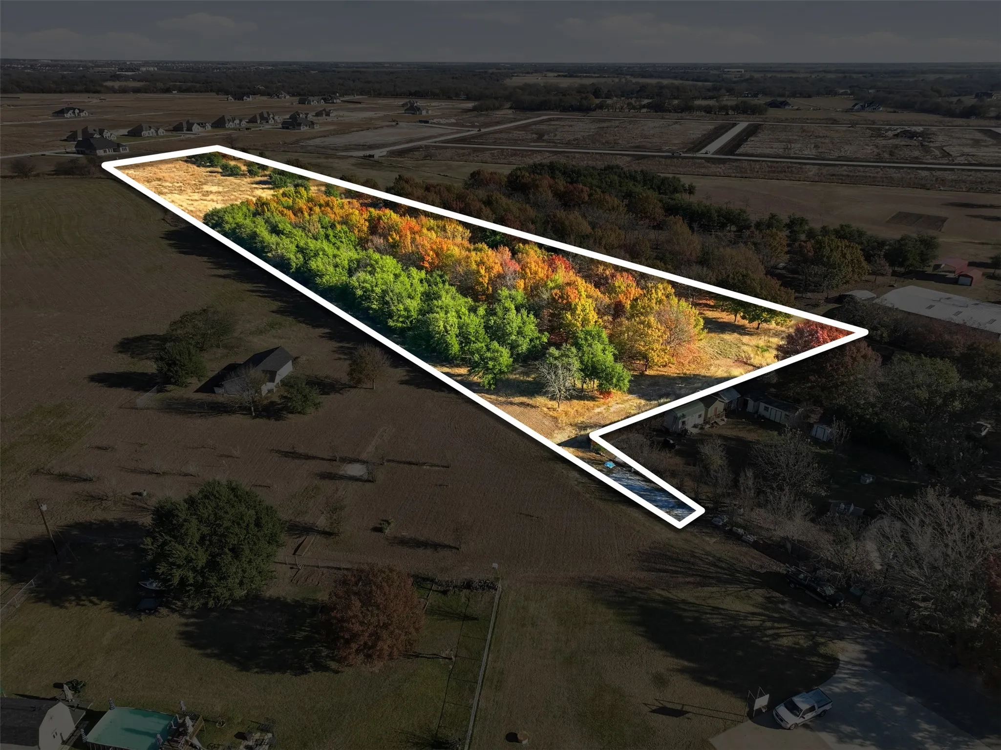 Overview of rural landscape with property parcel outlined