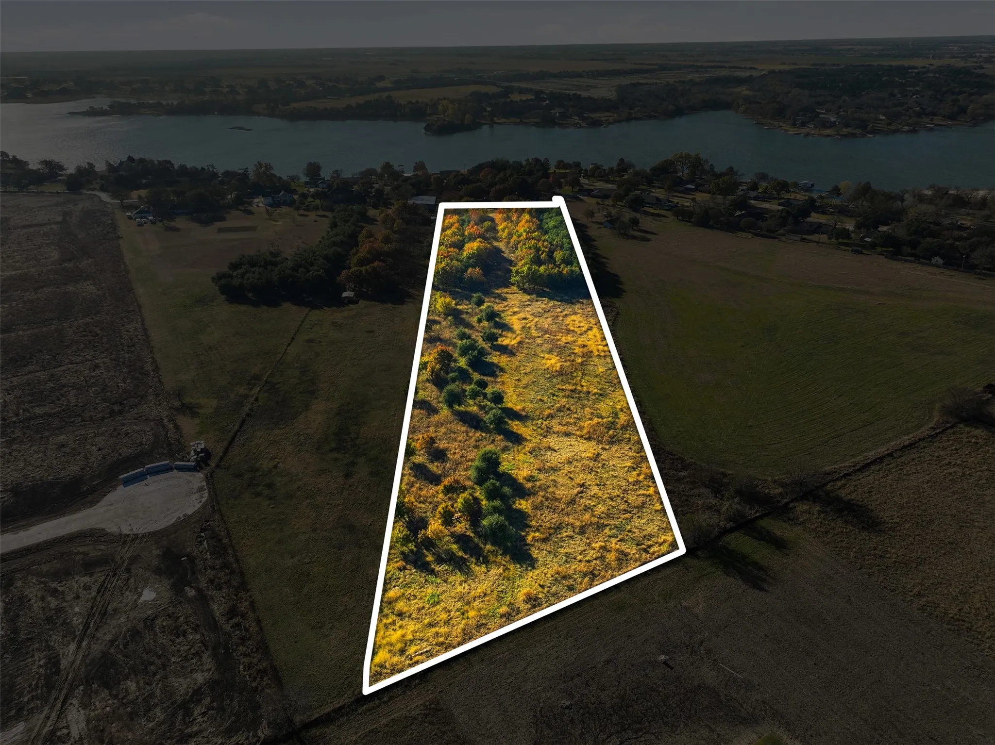 View of property location featuring property parcel outlined and a nearby body of water