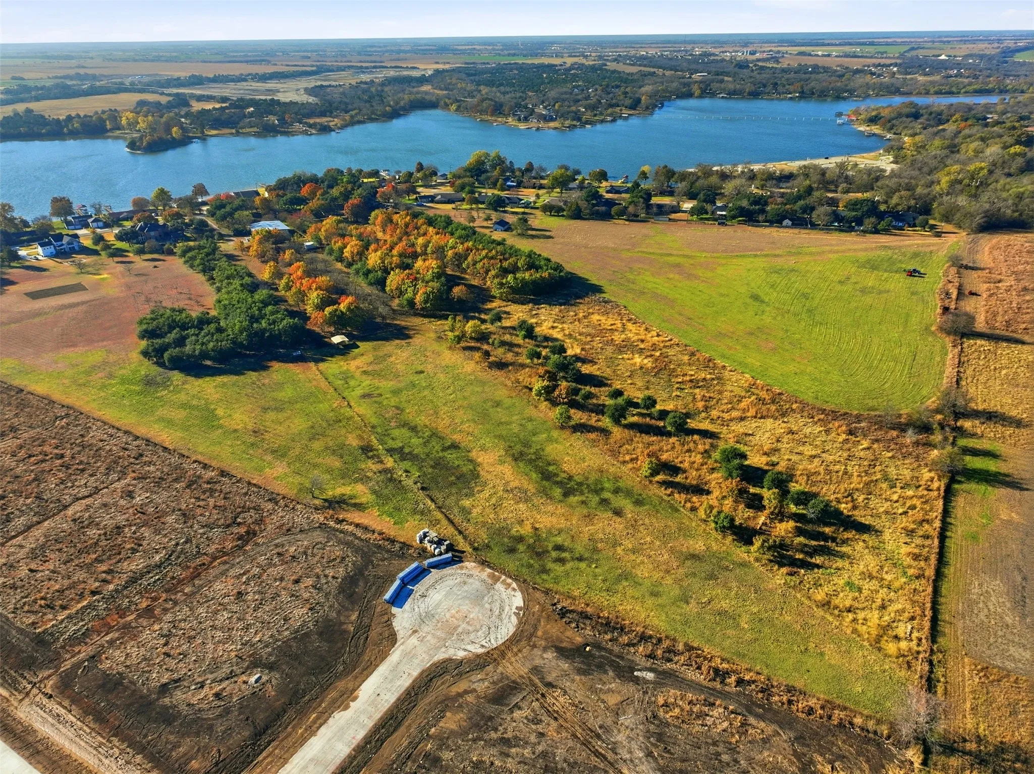 Aerial overview of property's location with a nearby body of water