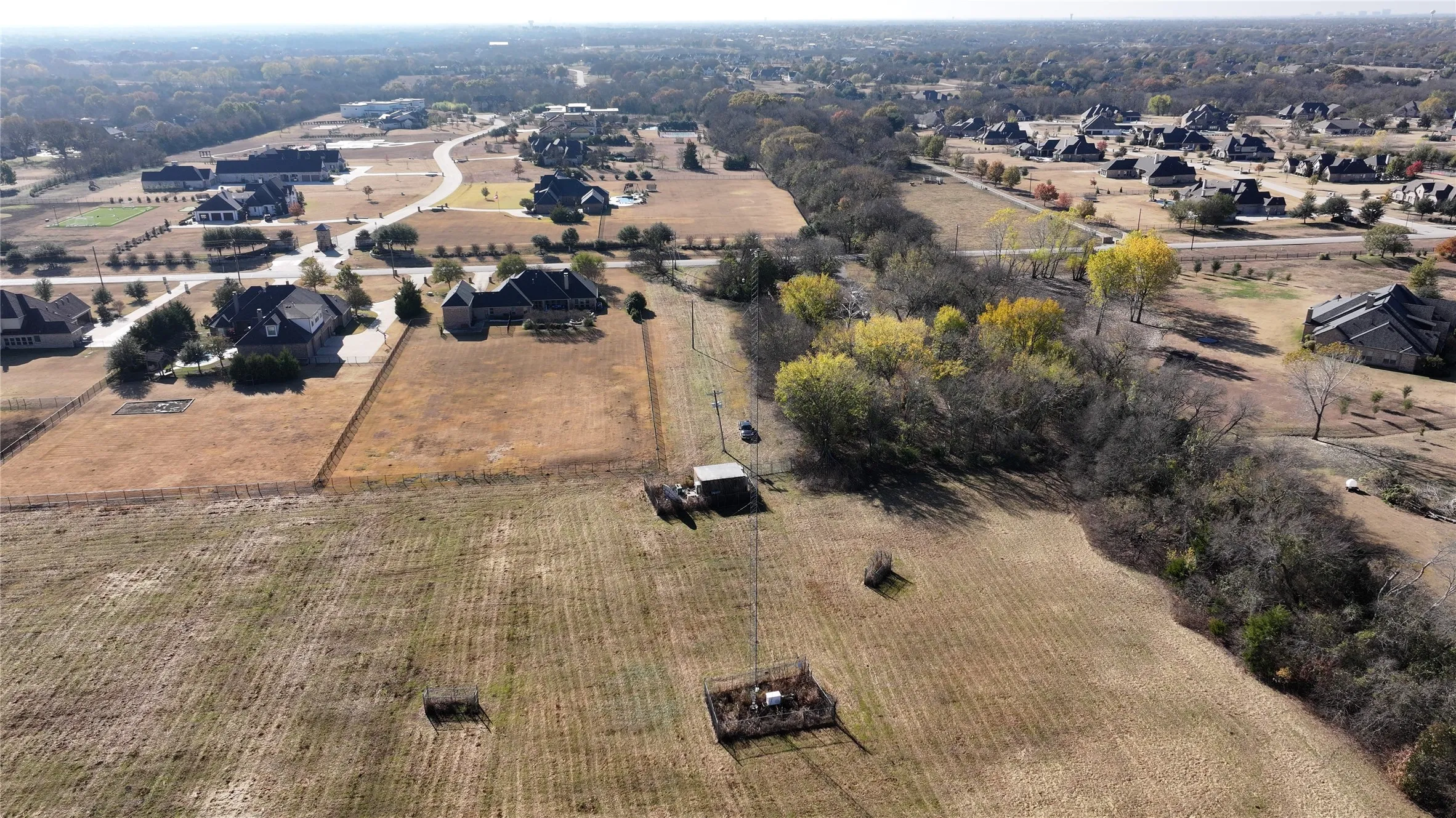 Property runs along a tree-lined creek.