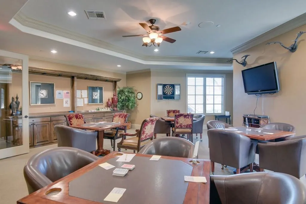 Club House Dining room featuring ceiling fan, a tray ceiling, recessed lighting, crown molding, and light colored carpet