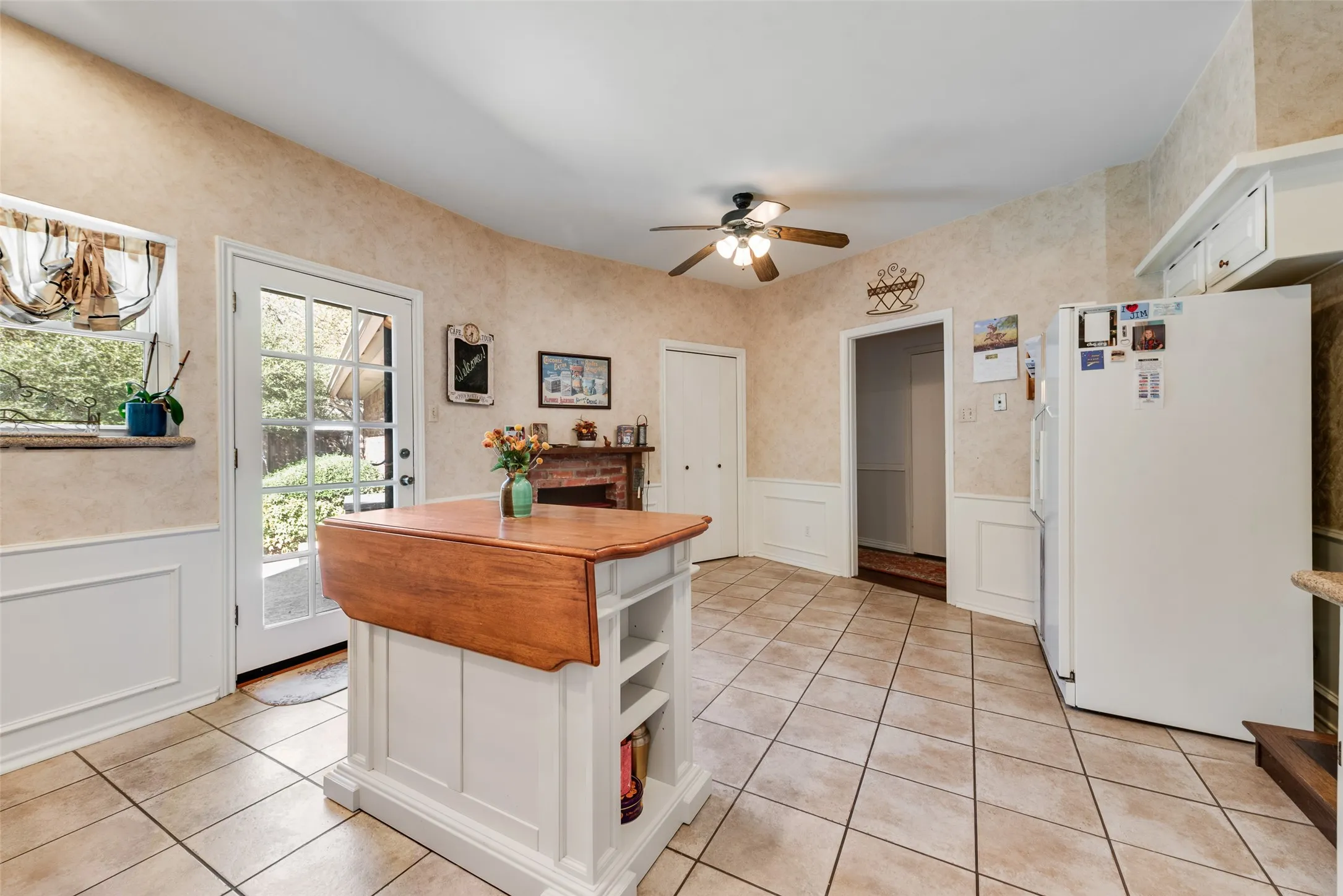Spacious kitchen with enough room for an eat-in kitchen. Also, access to the backyard and pool.