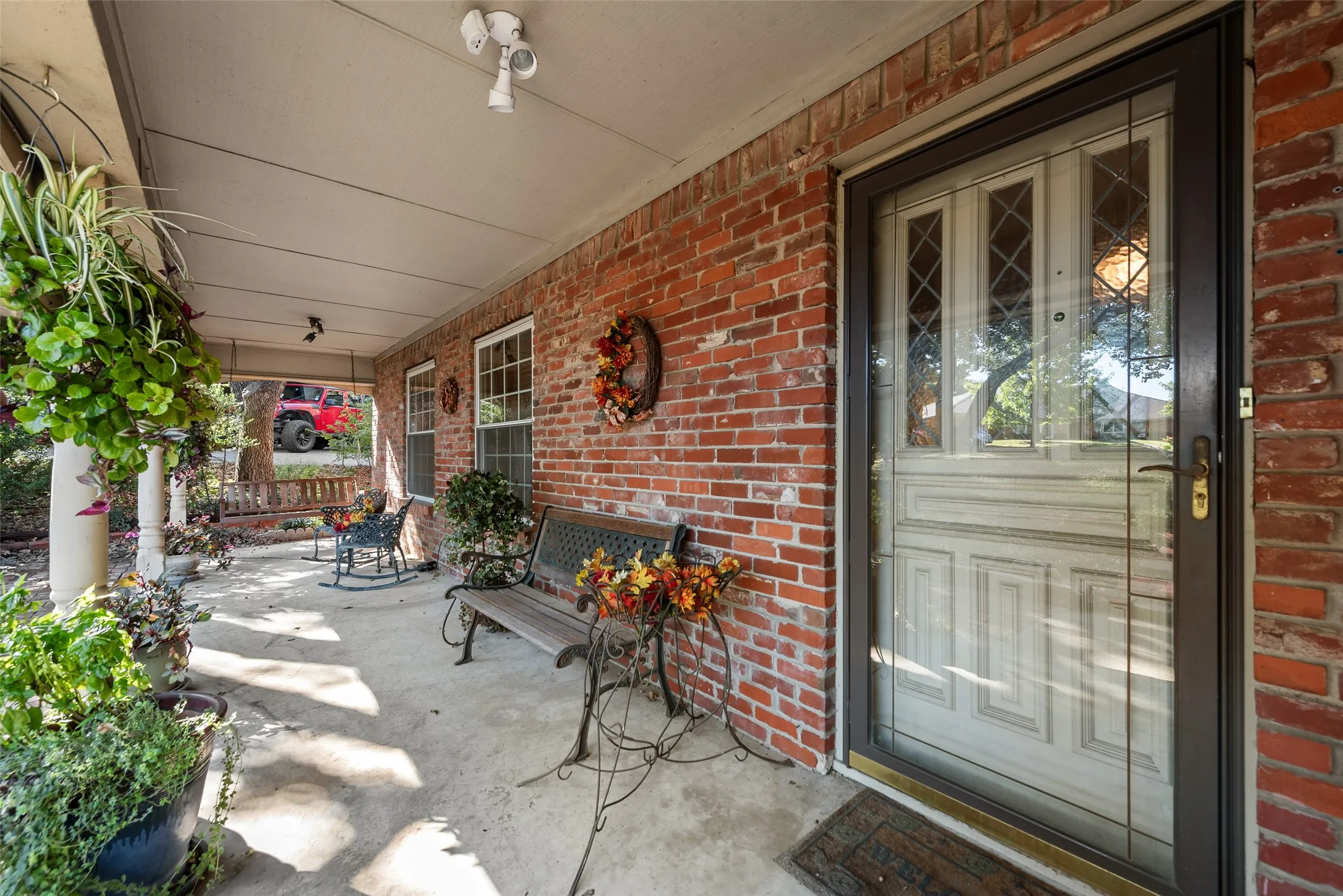 The inviting, covered front porch with plenty of room for sitting and enjoying the outdoors.