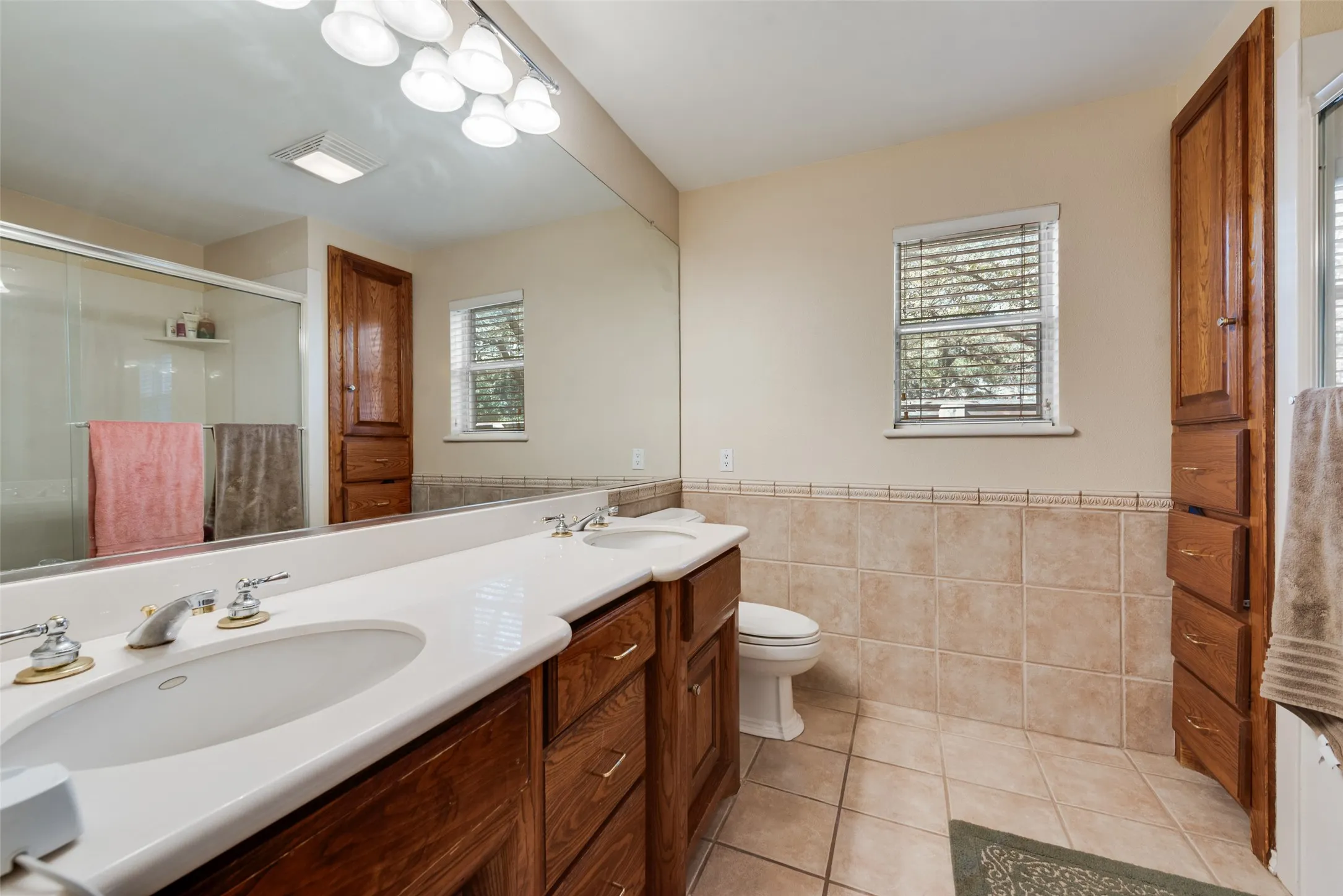 Primary bathroom features double sinks as well as a jetted tub