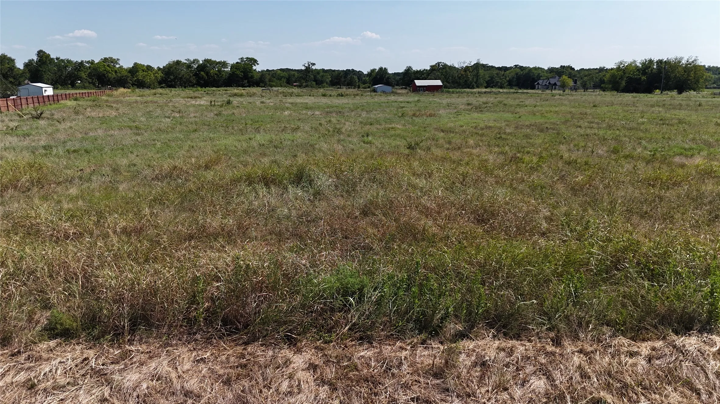 Expansive acreage featuring open pastureland with native grasses and vegetation