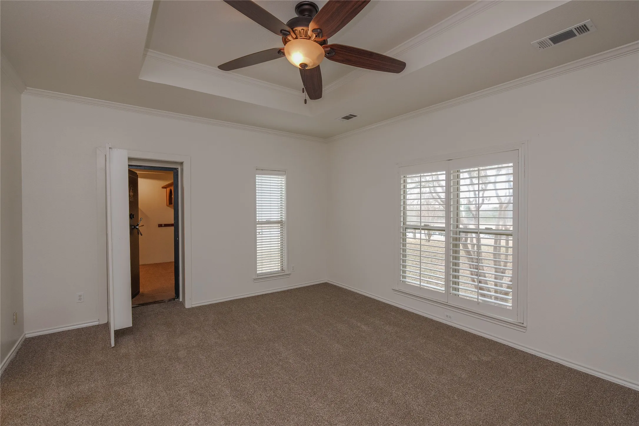 Primary Bedroom on first floor looks out the to front to the pond.