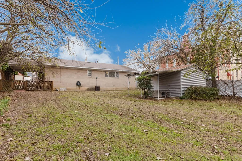 Spacious backyard with a shed for extra storage.