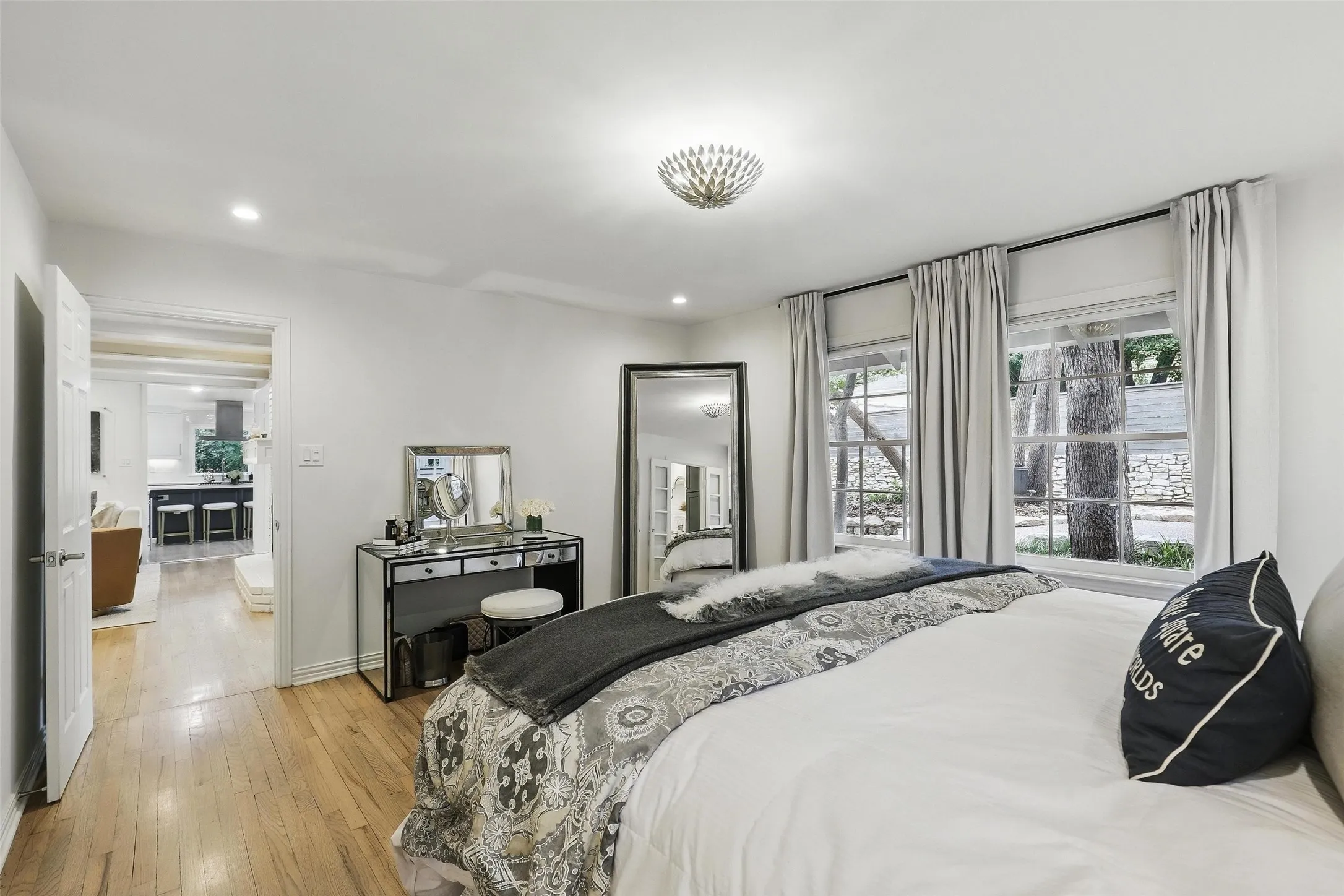 Bedroom with light wood-style floors and recessed lighting