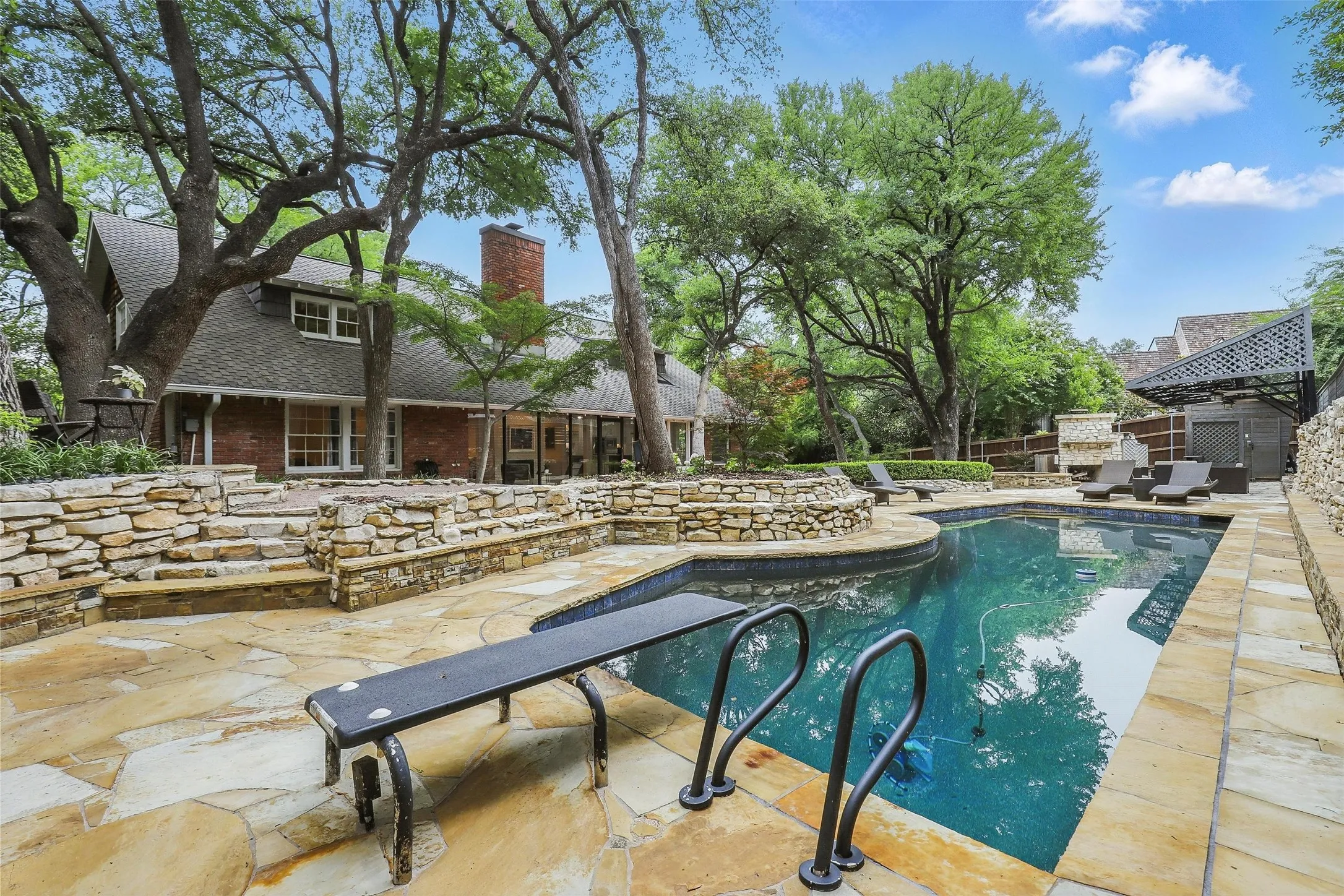 Outdoor pool featuring a patio area