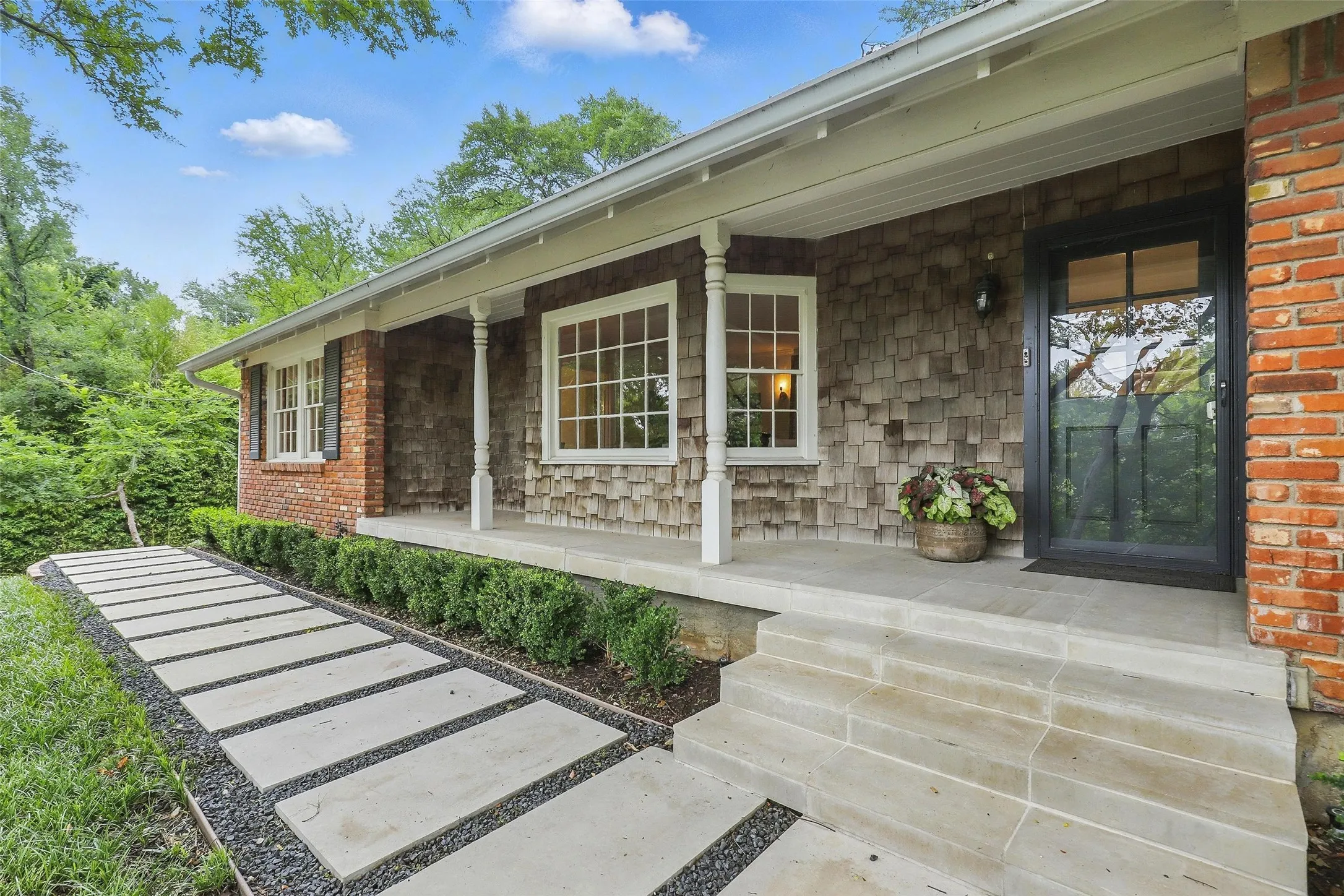 View of exterior entry featuring a porch