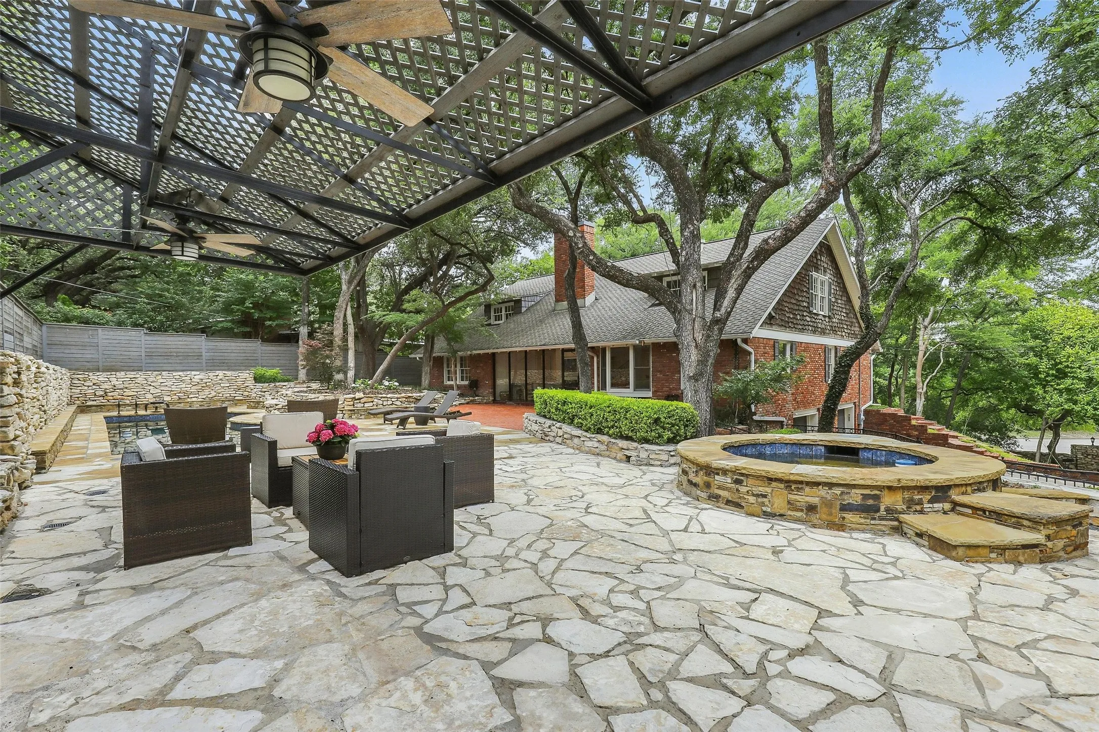 View of patio / terrace with an outdoor hangout area, a pergola, an in-ground hot tub, and outdoor dining space