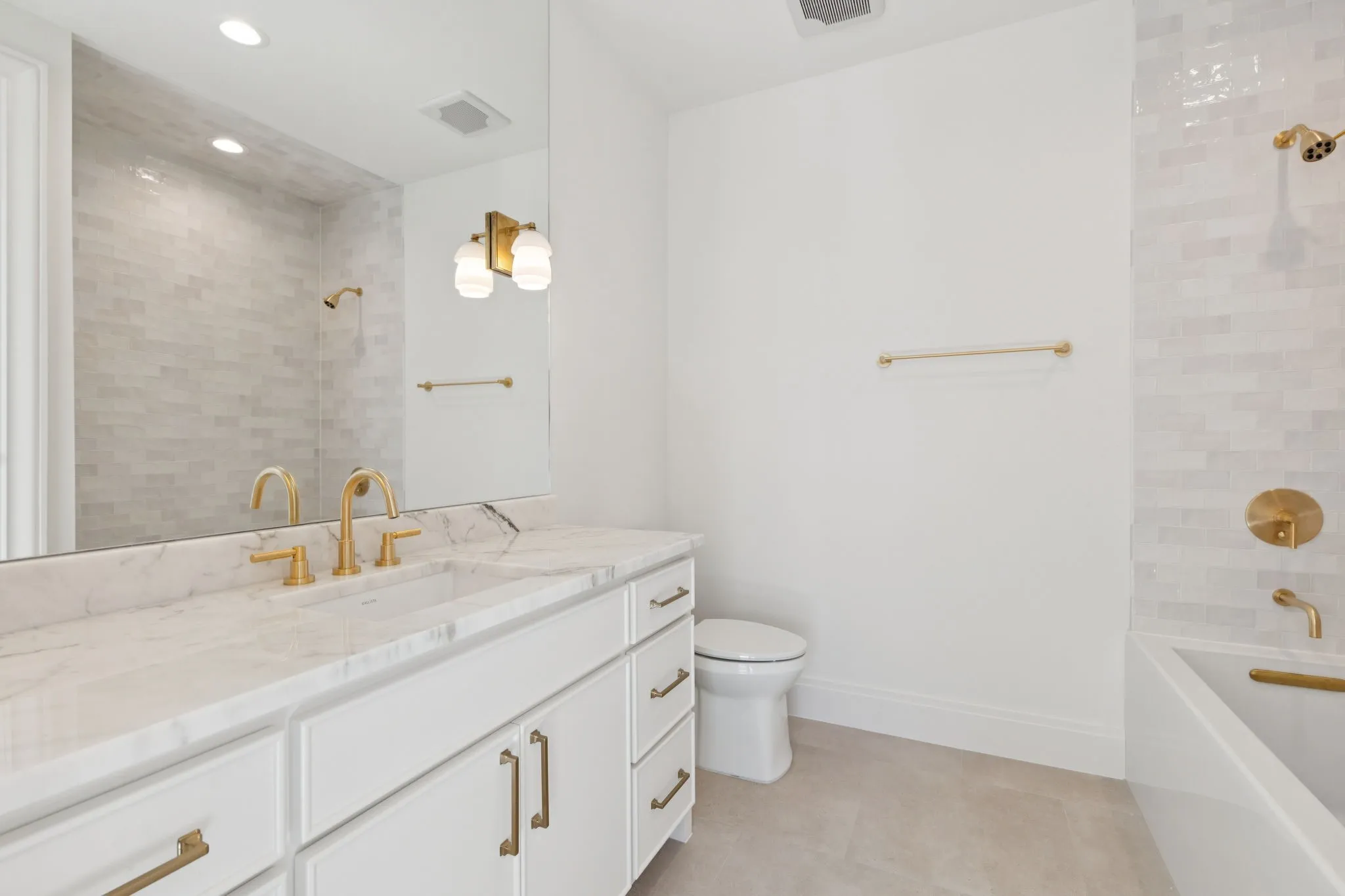 Bathroom with vanity, recessed lighting, and tub / shower combination
