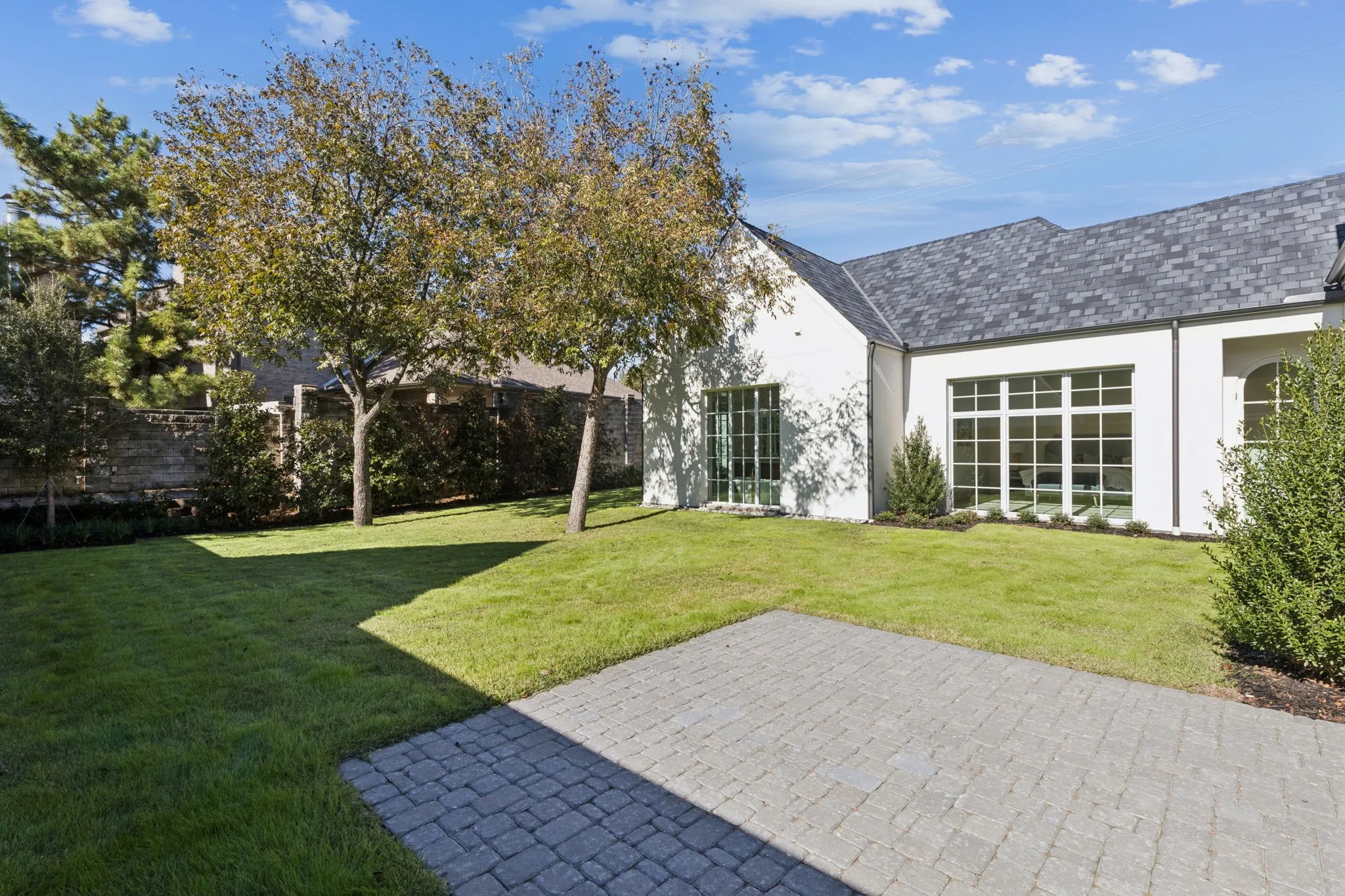 View of green lawn featuring a patio area