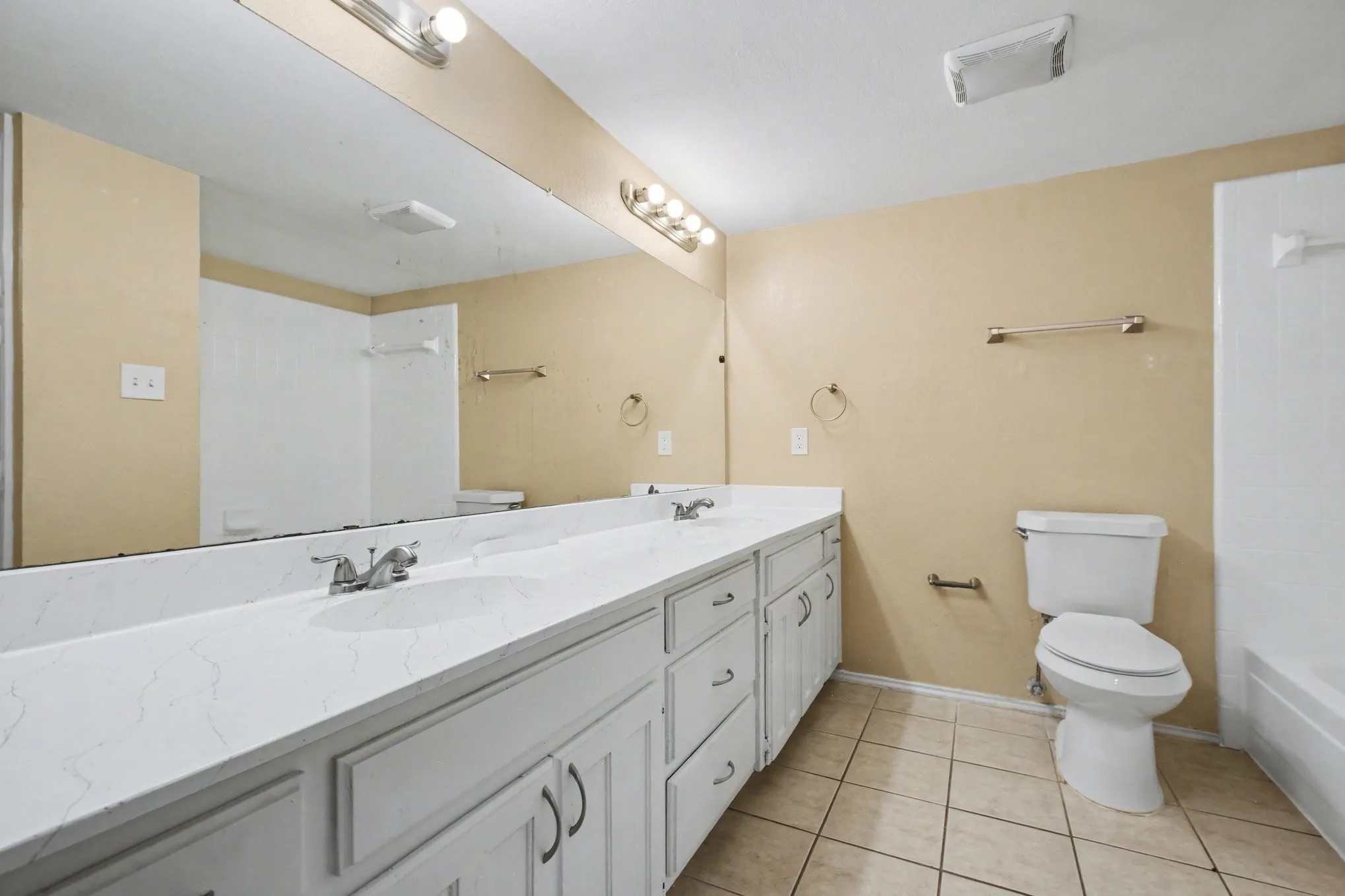 Downstairs primary bathroom that is also accessed from hallway for guest to use.