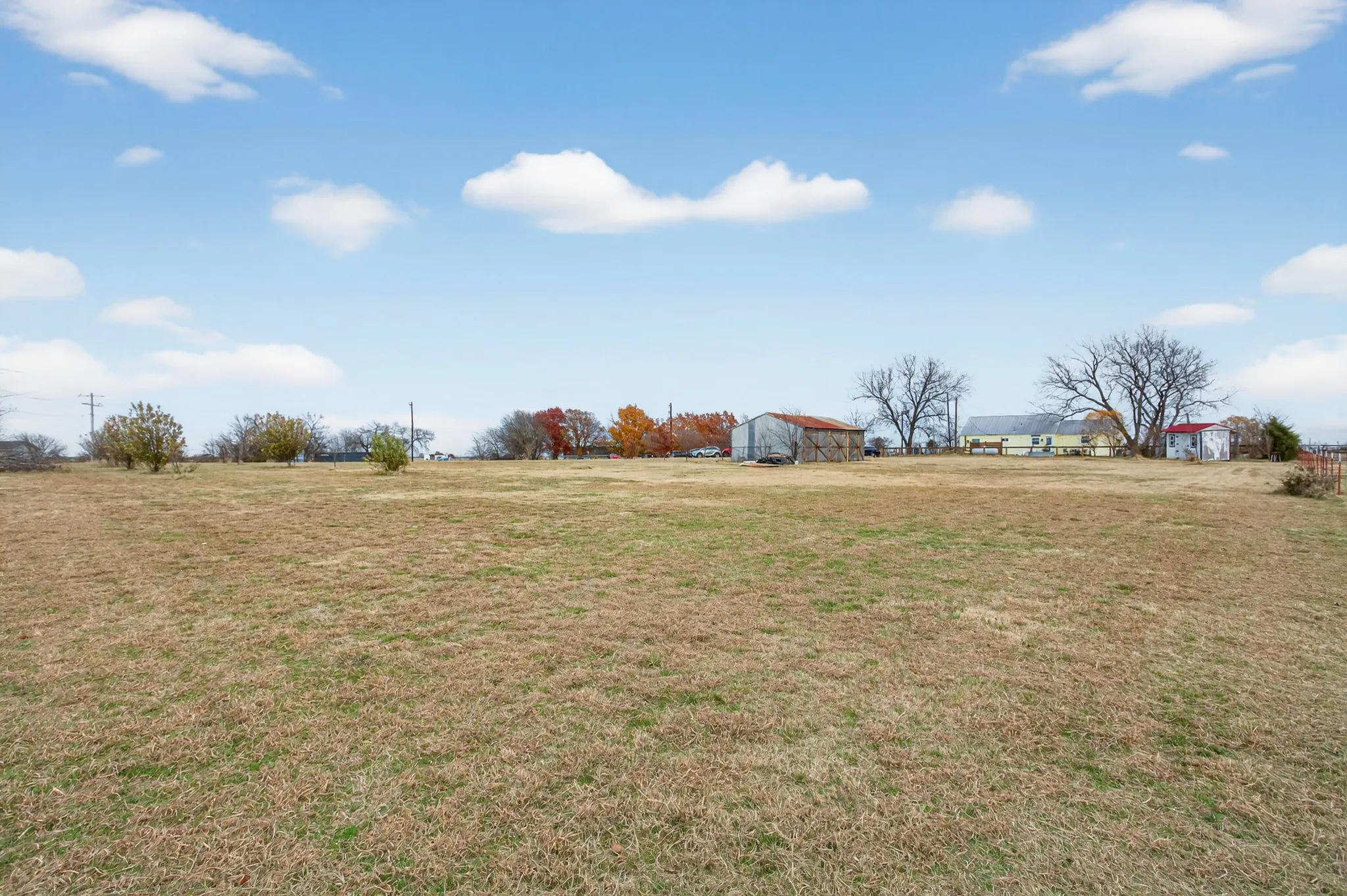 2 acre property with fruit trees, pecan trees, chicken coop, storage, well house...