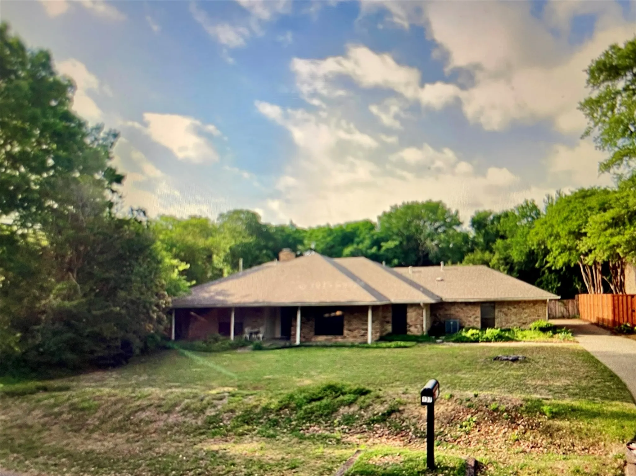 Custom-built 1981 home on 1.6 ACRE lot with CREEK!