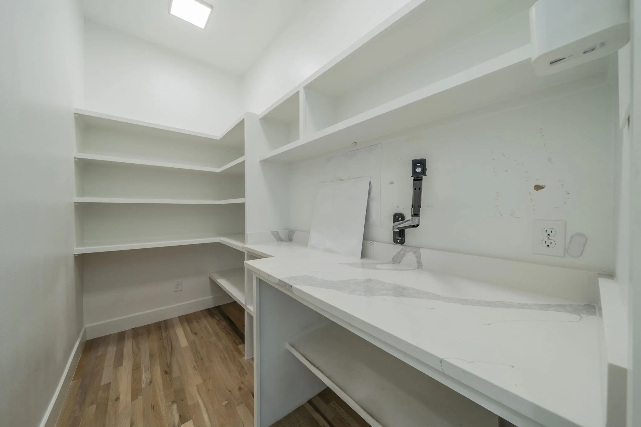 Storage area featuring a wall mounted air conditioner