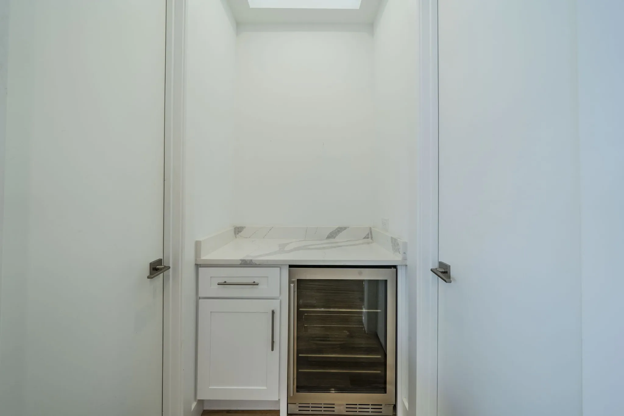 Detailed view of beverage cooler and a skylight