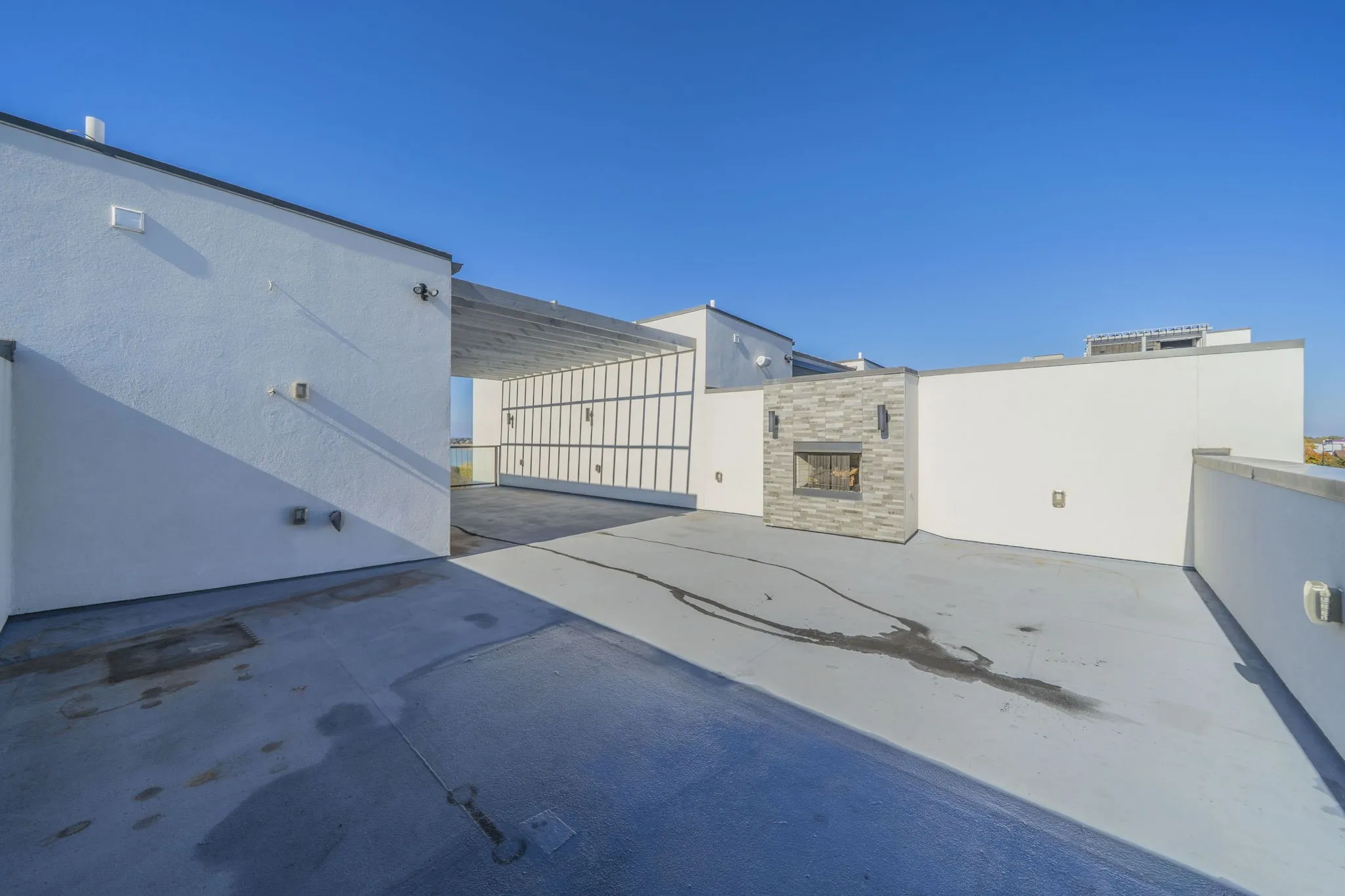 Large rooftop area with a fireplace