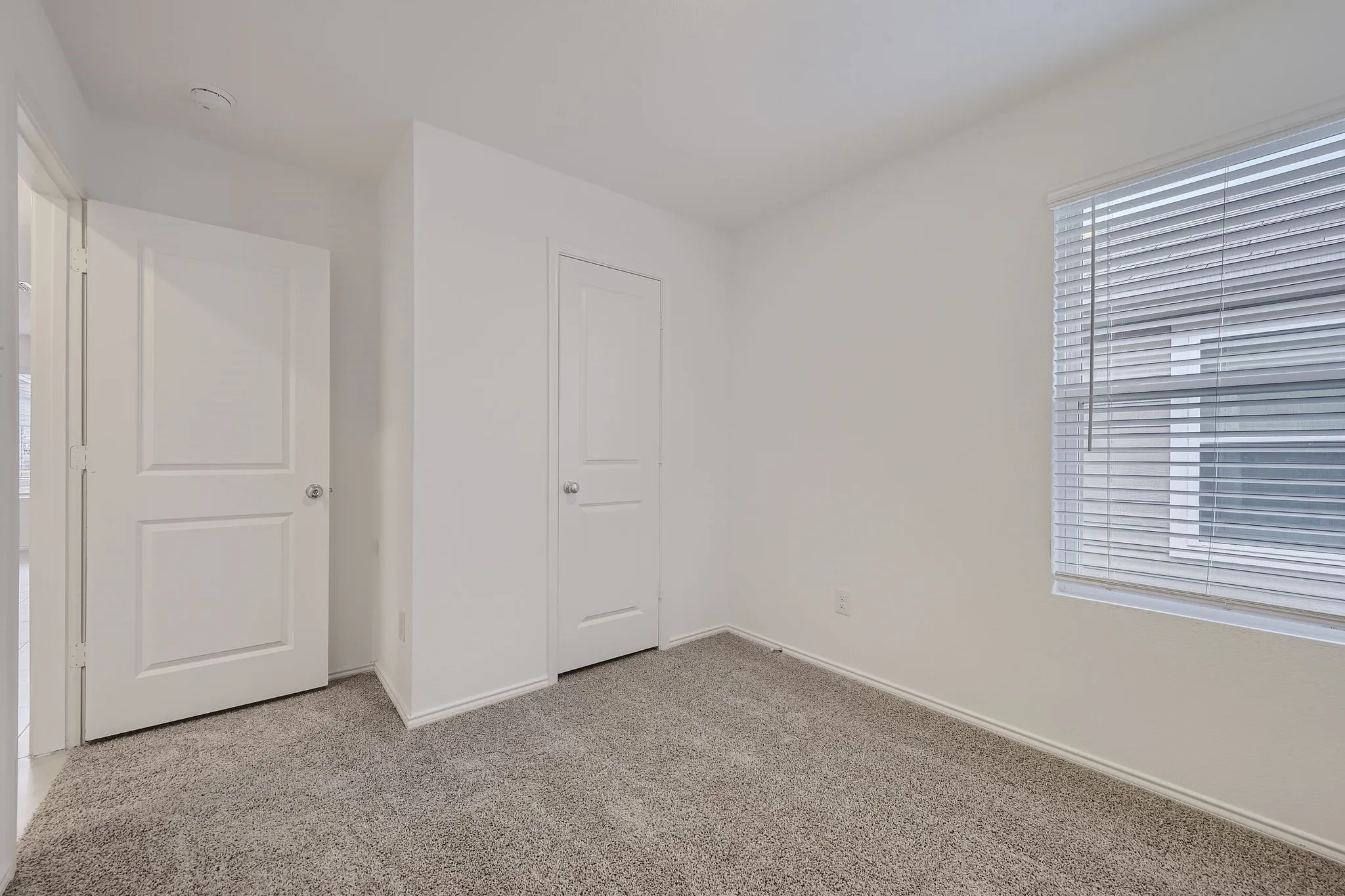 Carpeted secondary bedroom