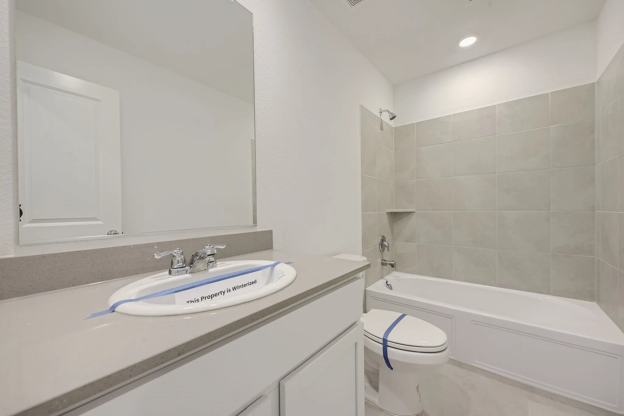 Second full bathroom featuring  shower combination and vanity