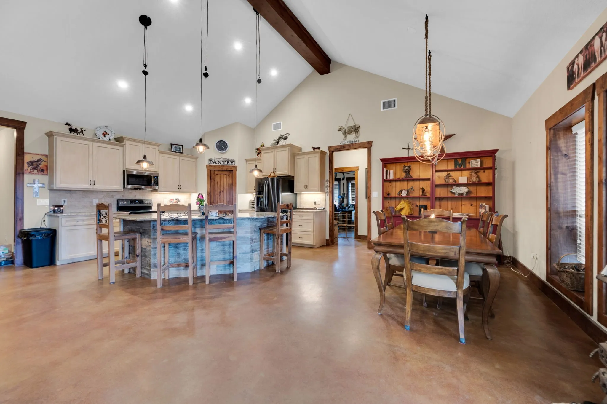 Easy to maintain stained concrete floors are perfect for this country life.