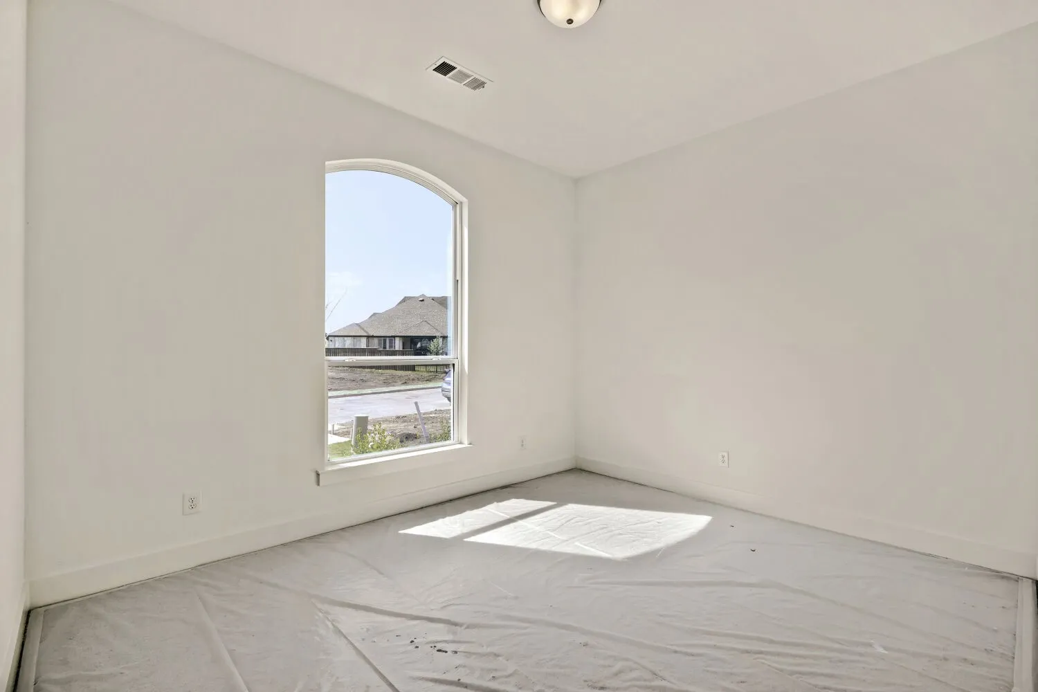 Unfurnished room with baseboards