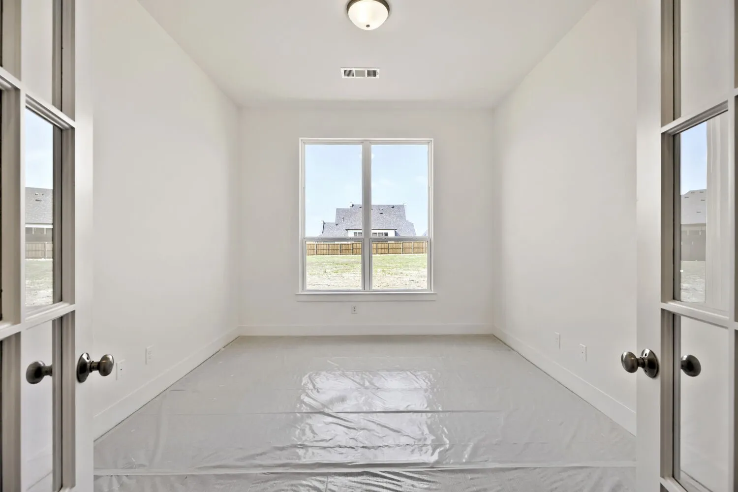 Unfurnished room with baseboards