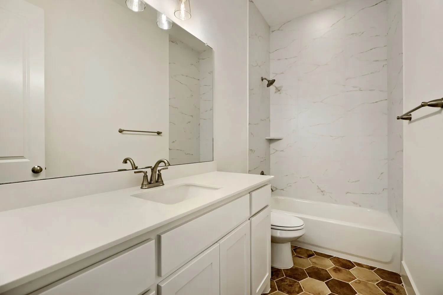 Bathroom featuring vanity and shower / tub combination