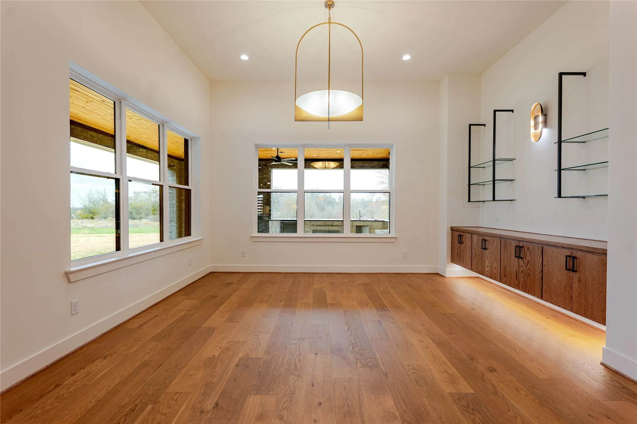 Unfurnished dining area featuring light wood-style flooring and recessed lighting
