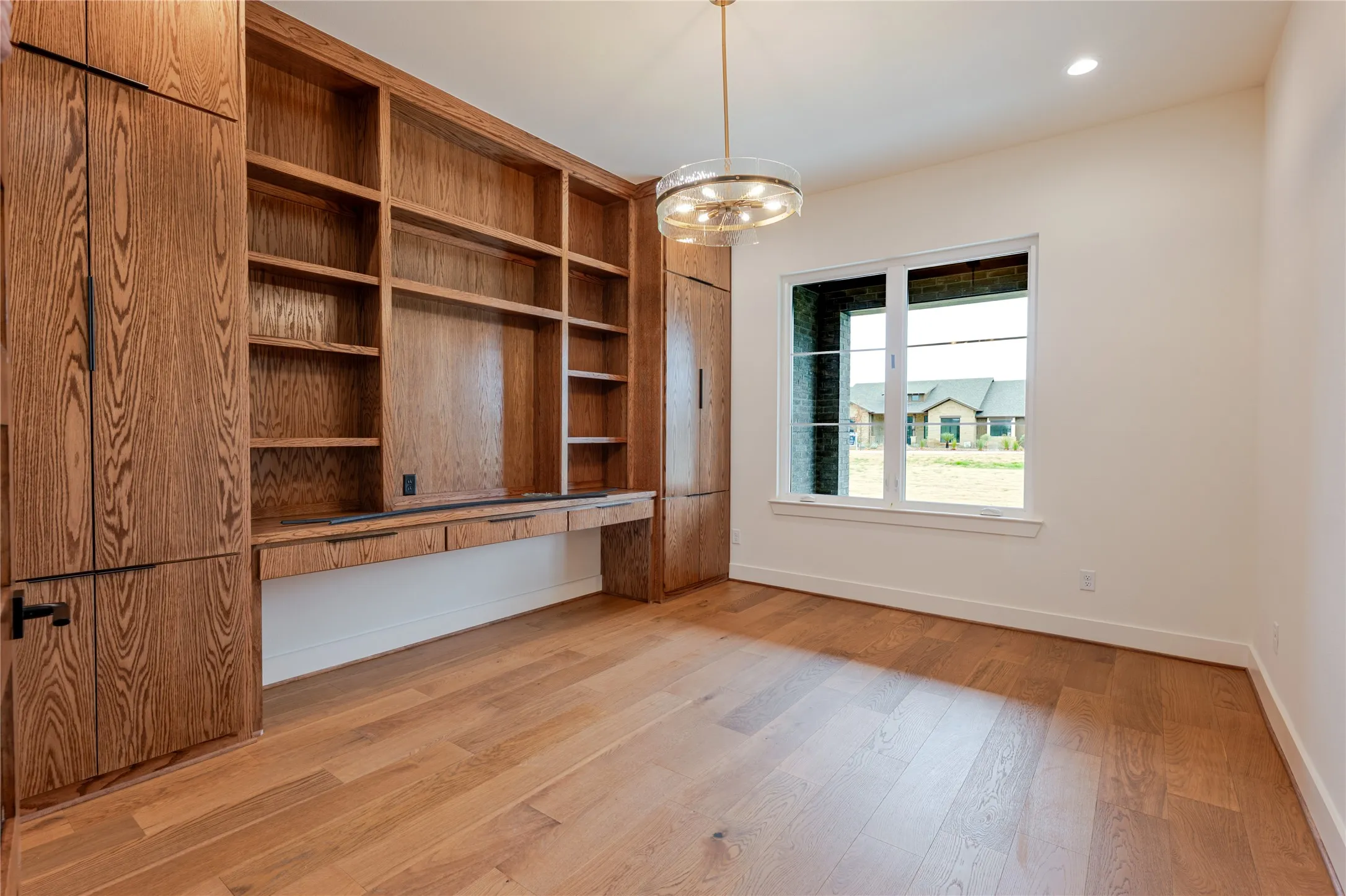 Front Office with built-in bookshelves and desk.