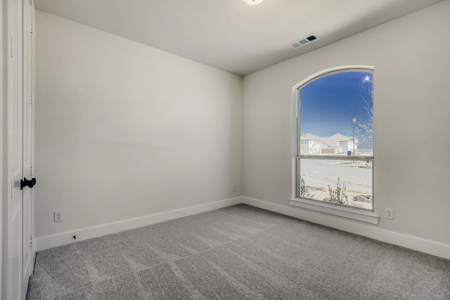 Unfurnished room with light carpet and baseboards