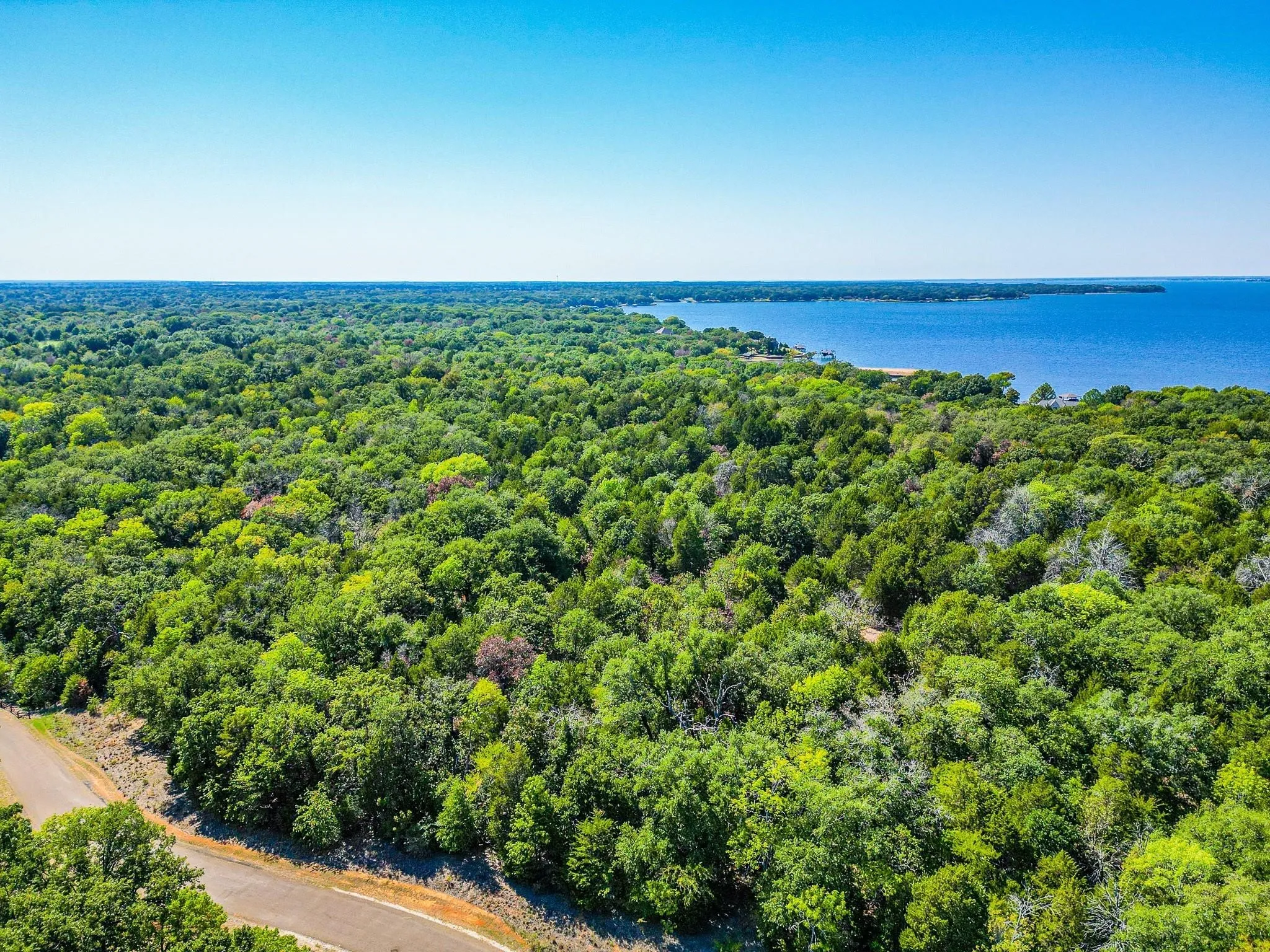 Lake RC beckons just beyond it's summer green trees