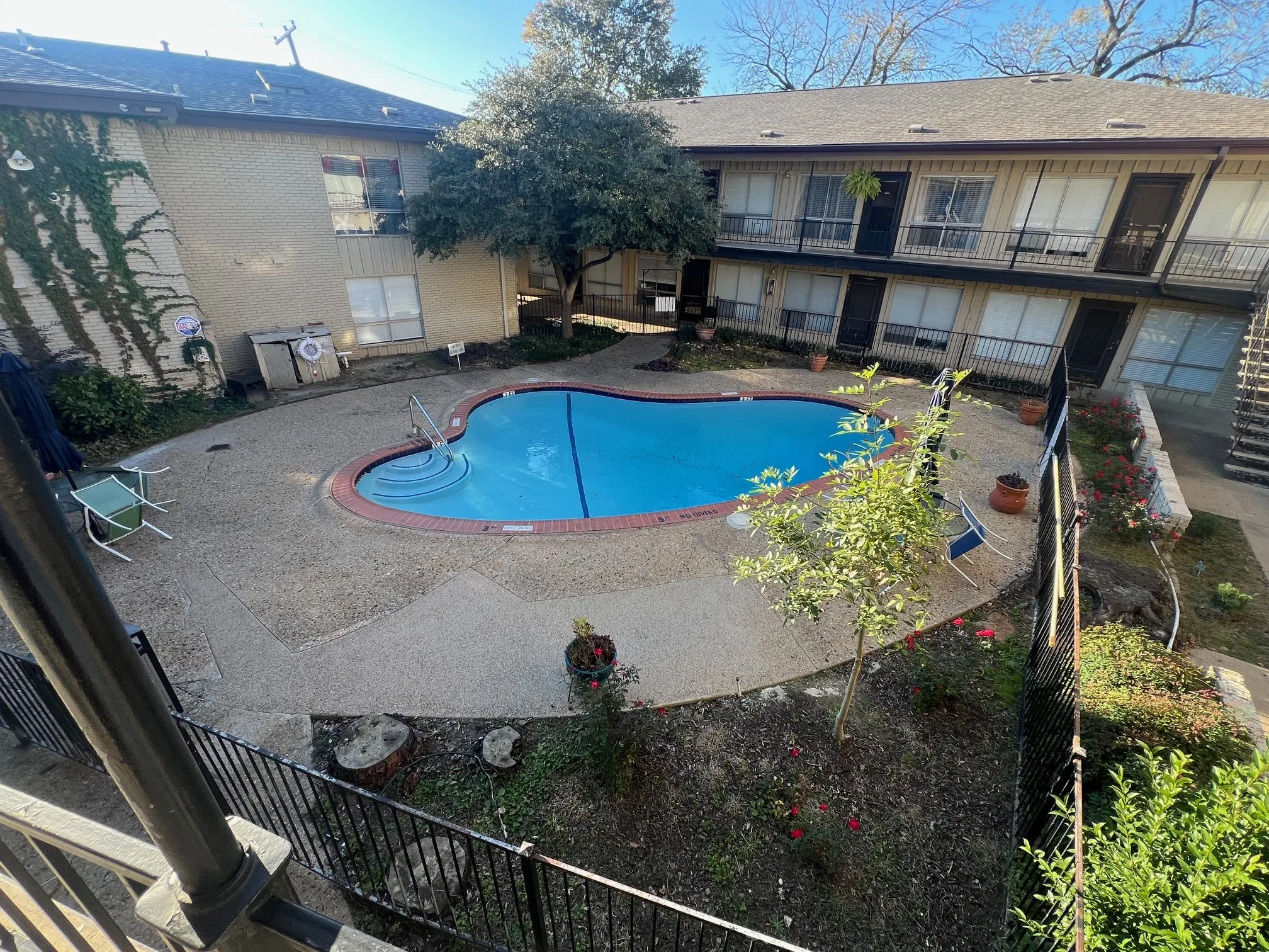Community pool with a balcony