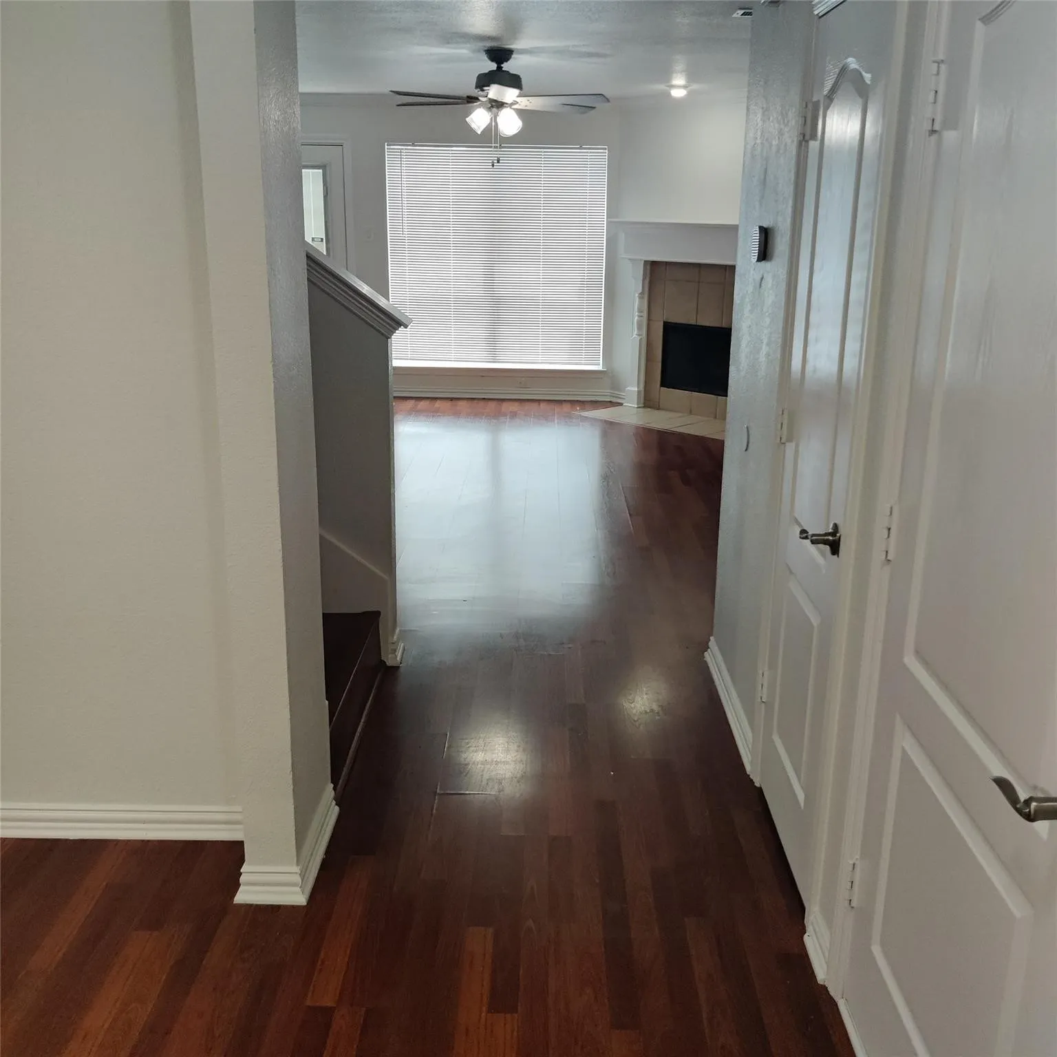 Corridor featuring dark wood-style floors