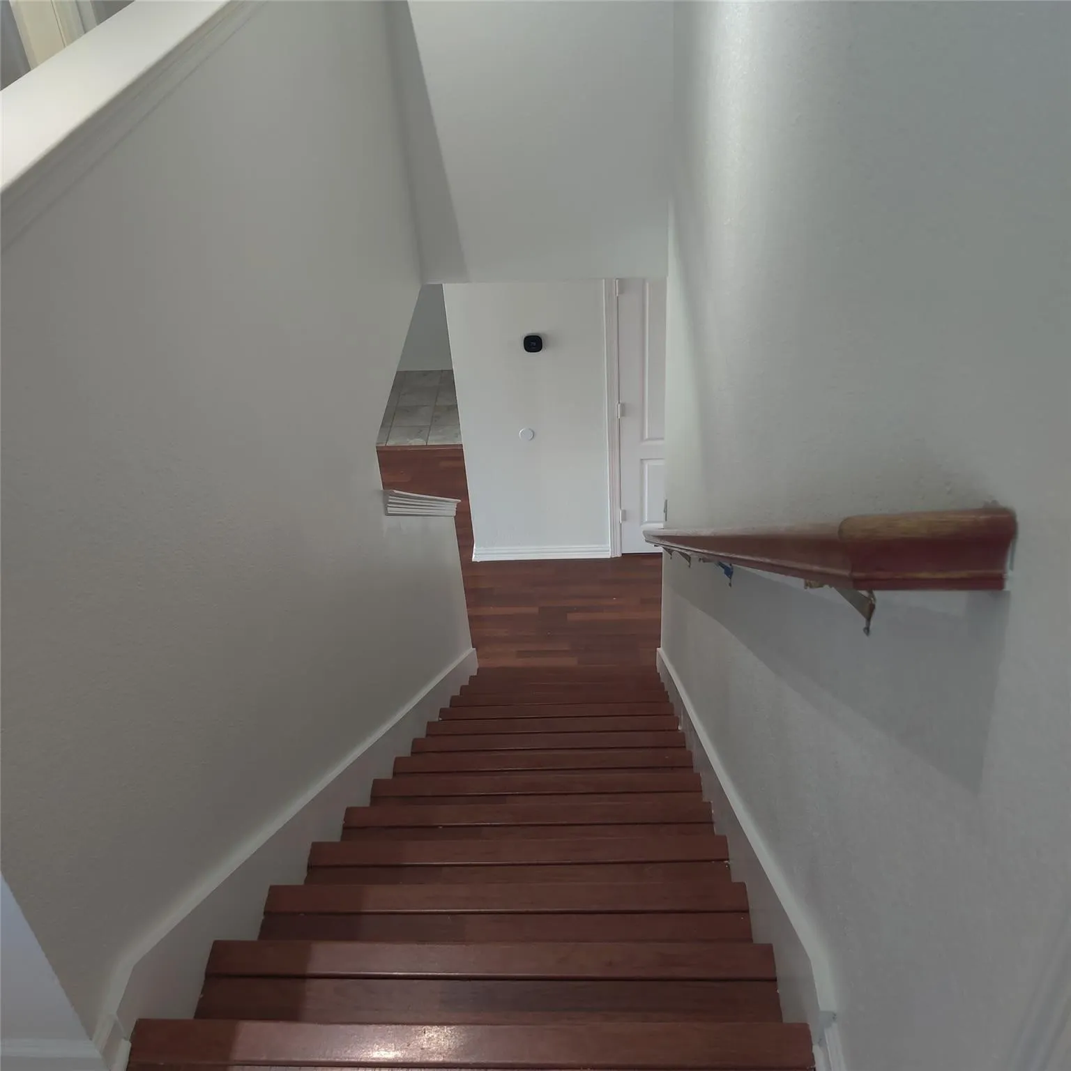 Stairway with wood finished floors