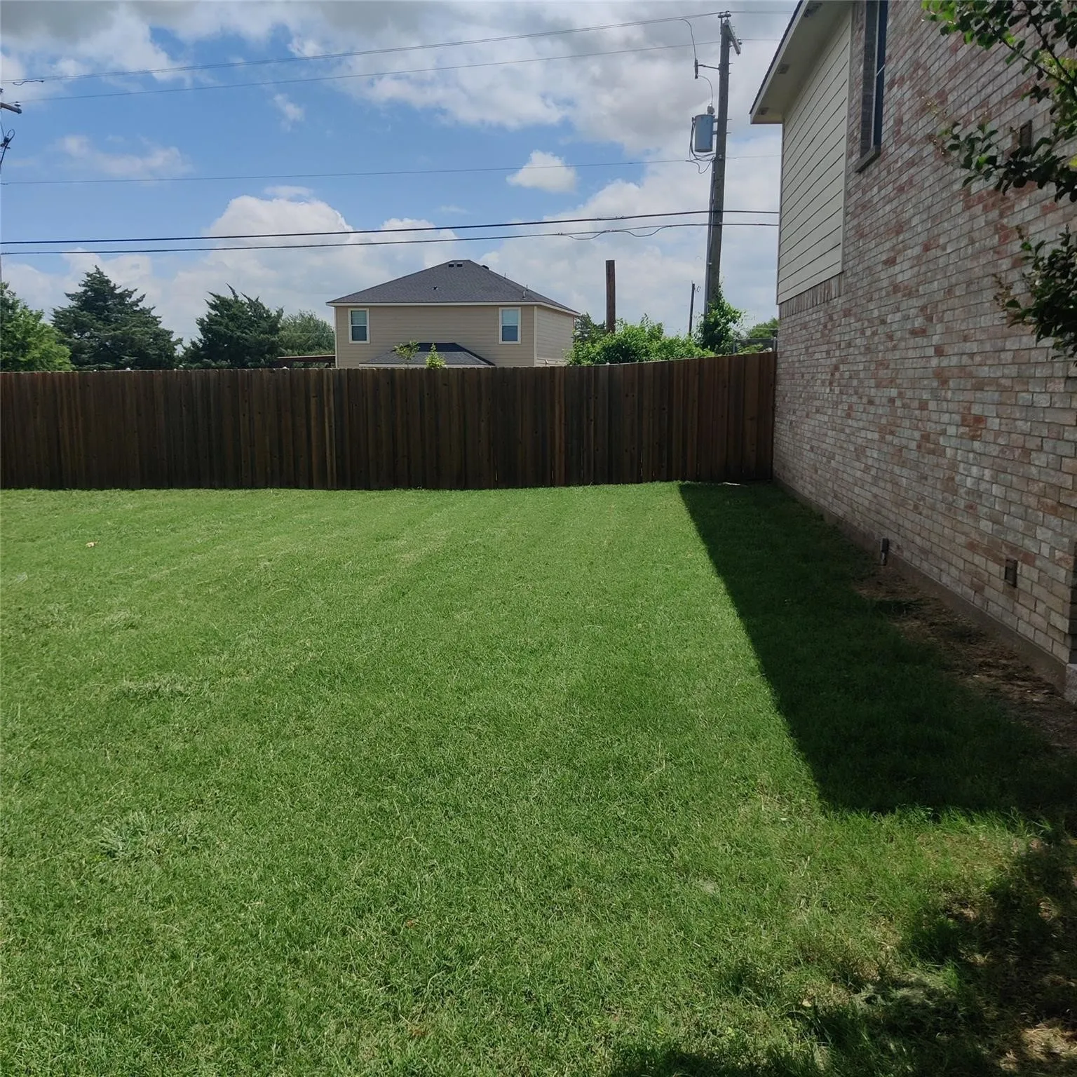 View of fenced backyard