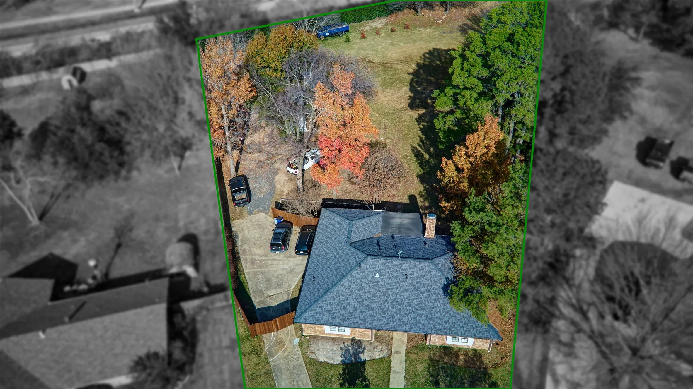 Aerial view of property and surrounding area featuring property parcel outlined