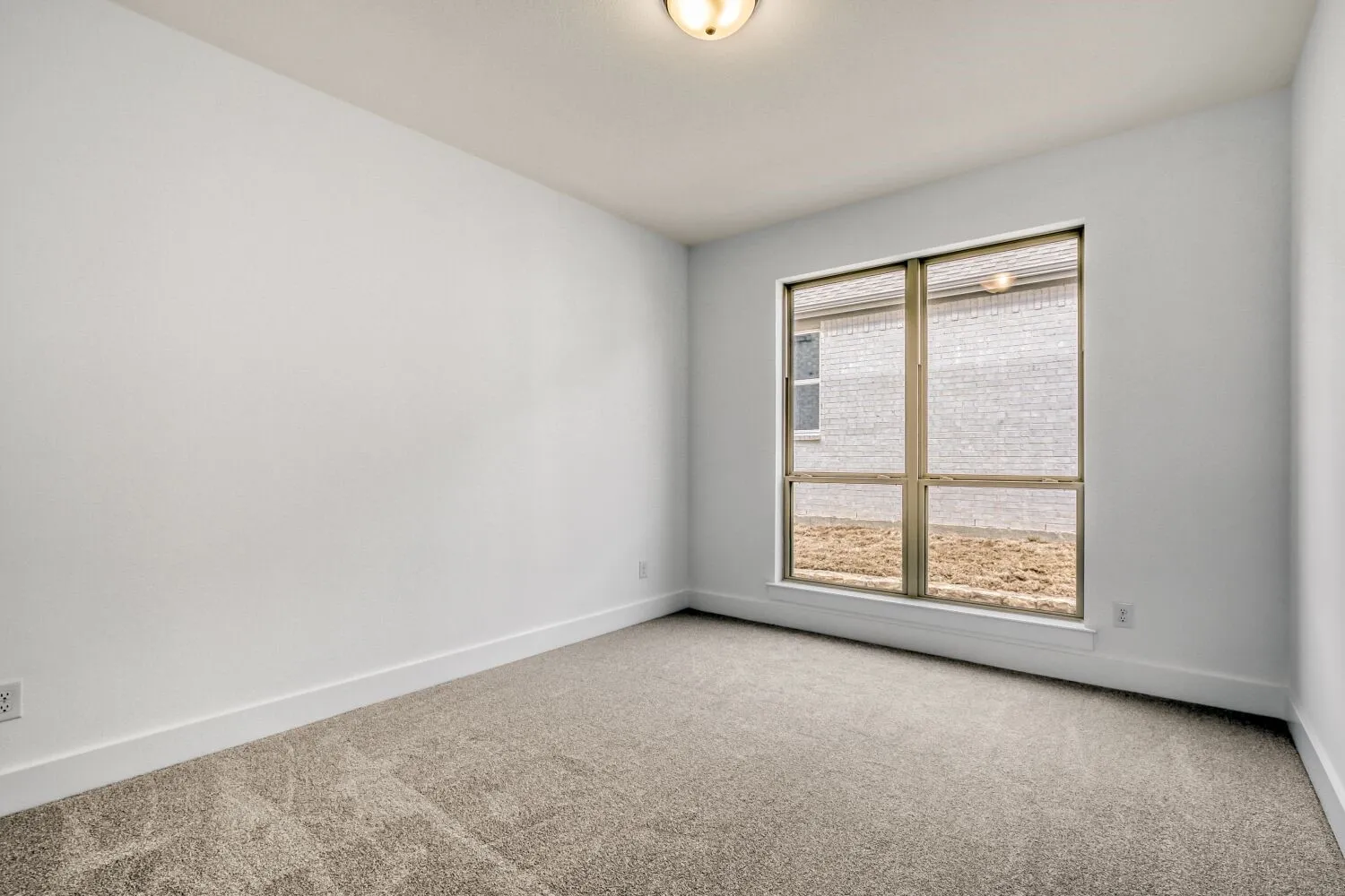 Unfurnished room with carpet flooring and baseboards