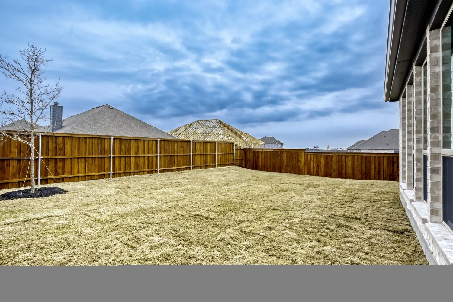 View of fenced backyard
