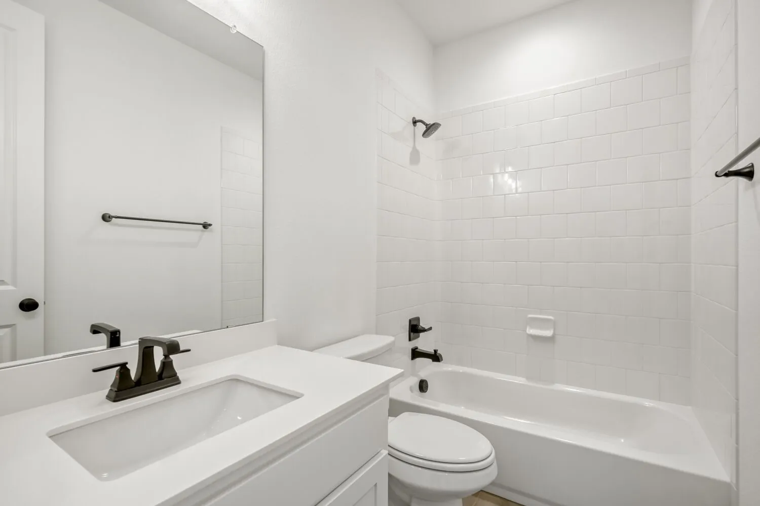 Full bathroom featuring vanity and washtub / shower combination