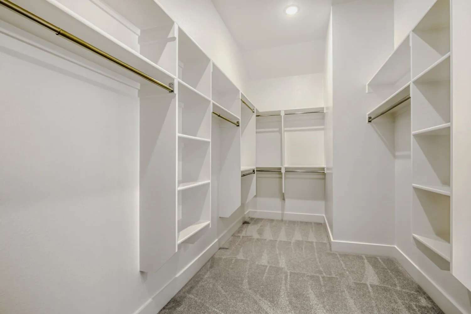 Walk in closet featuring light carpet