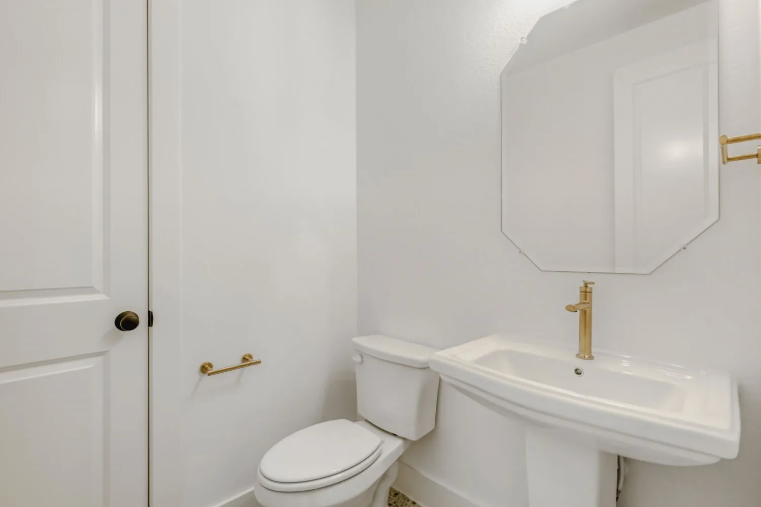 Half bathroom featuring toilet and a sink