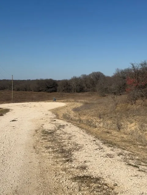 View from up higher on road looking down toward property