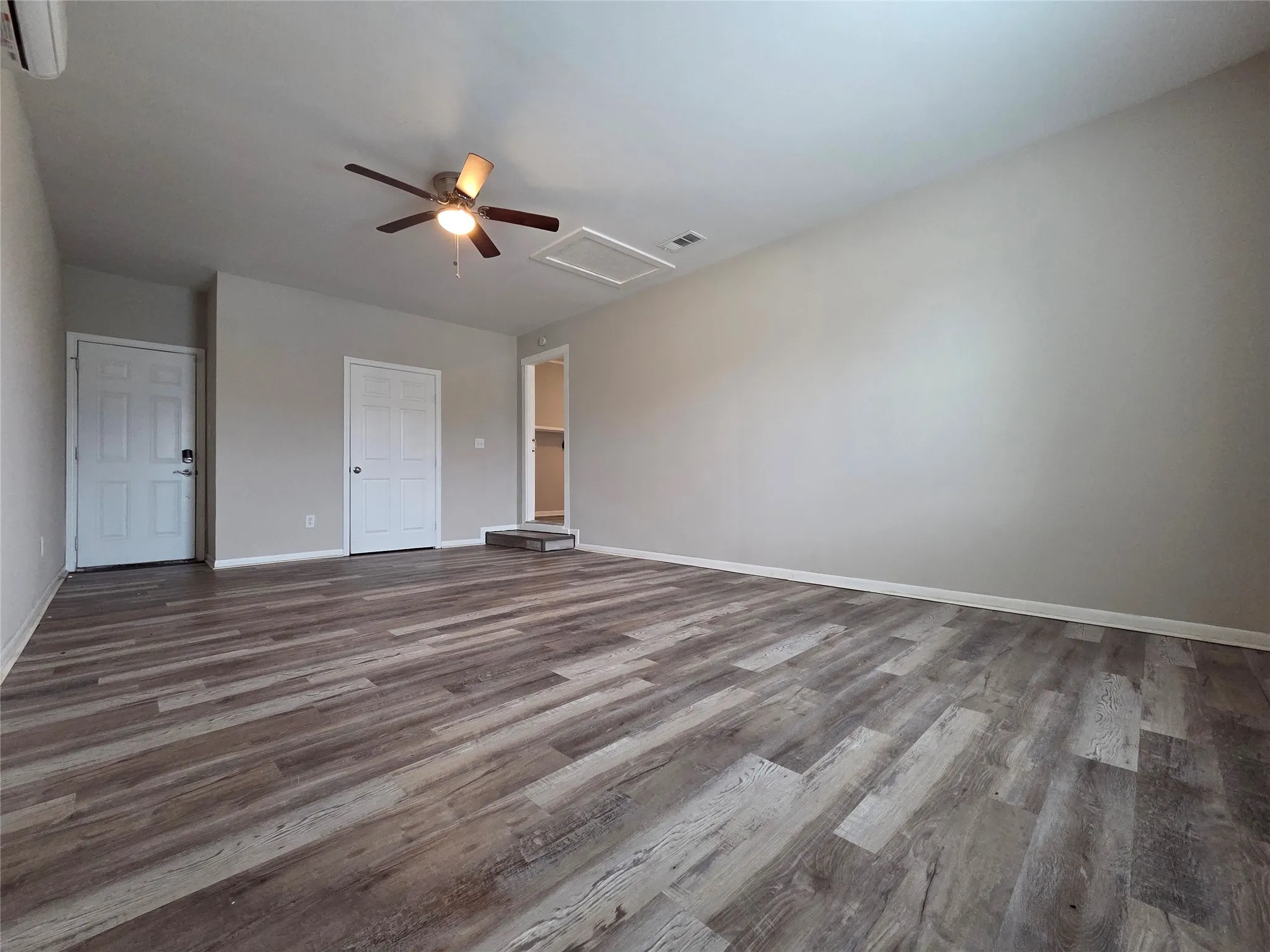 Unfurnished bedroom featuring light wood-style floors and ceiling fan