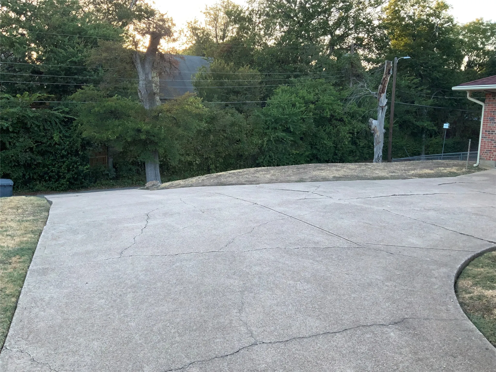 Concrete driveway with partial brick exterior