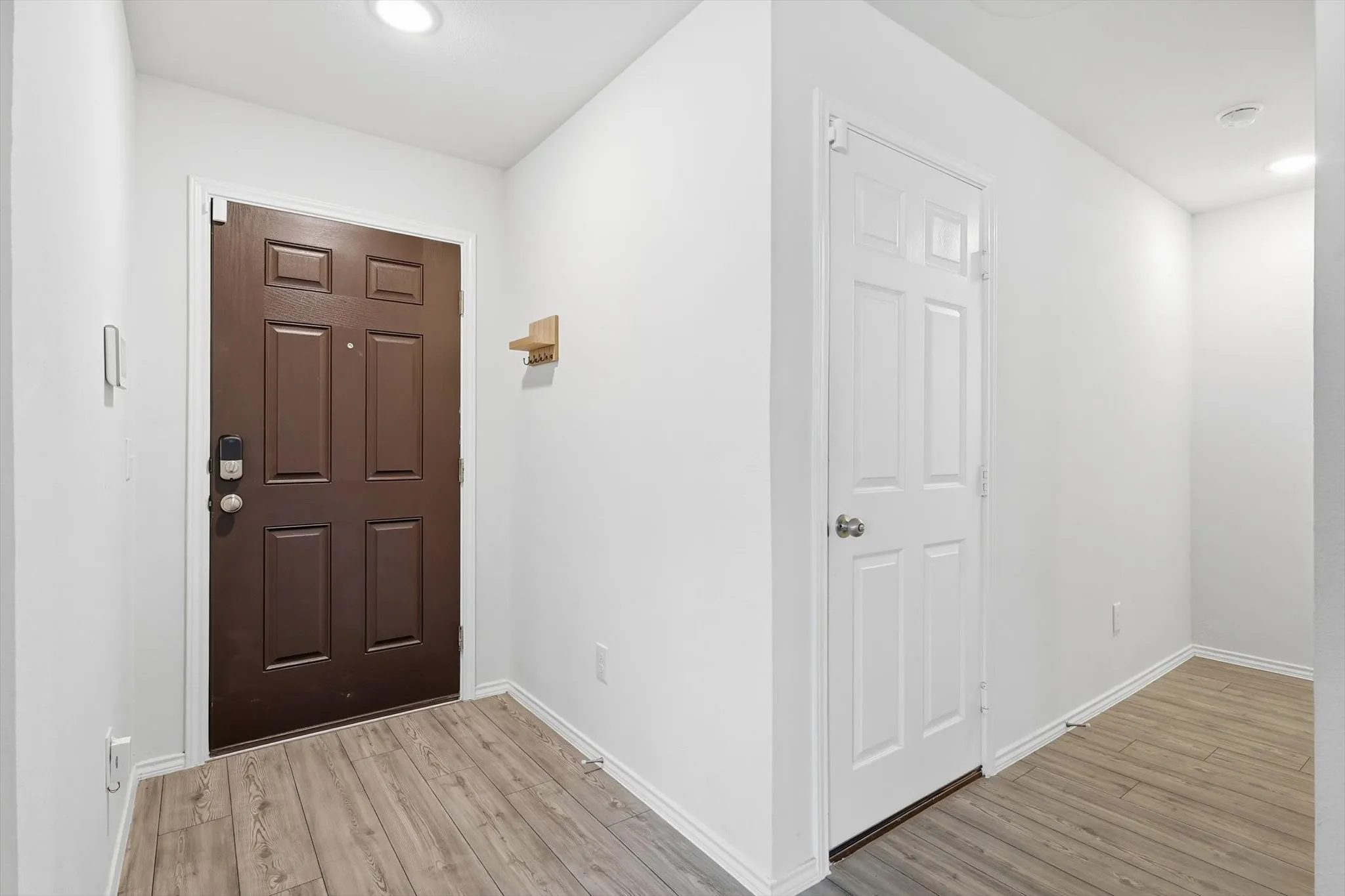 Entryway featuring recessed lighting and light wood-style floors