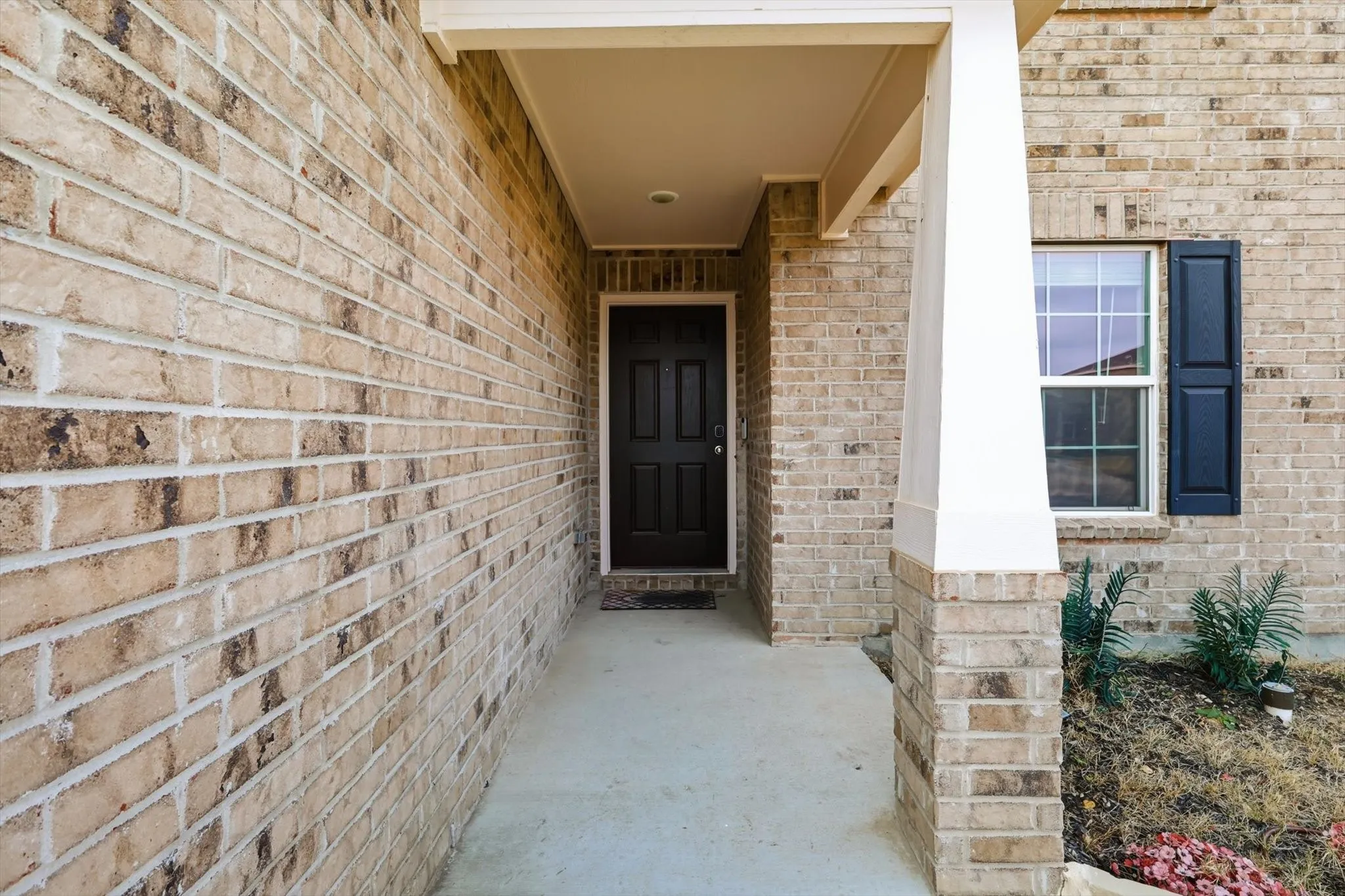 Long porch leading to the front door